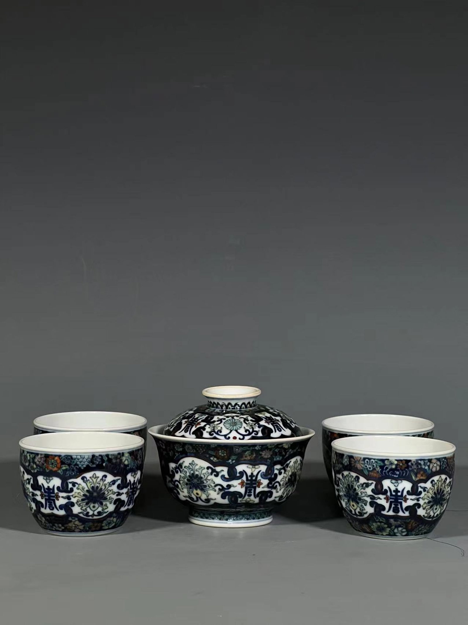 A Set of Fine Black Ground Famille-Rose Lotus Pattern Bowls with Cover: A Set of Fine Black Ground Famille-Rose Lotus Pattern Bowls with Cover,Qing Dynasty,China,Qianlong Six-character Mark,Size:3.4inx4.1in 一套墨地粉彩缠枝&