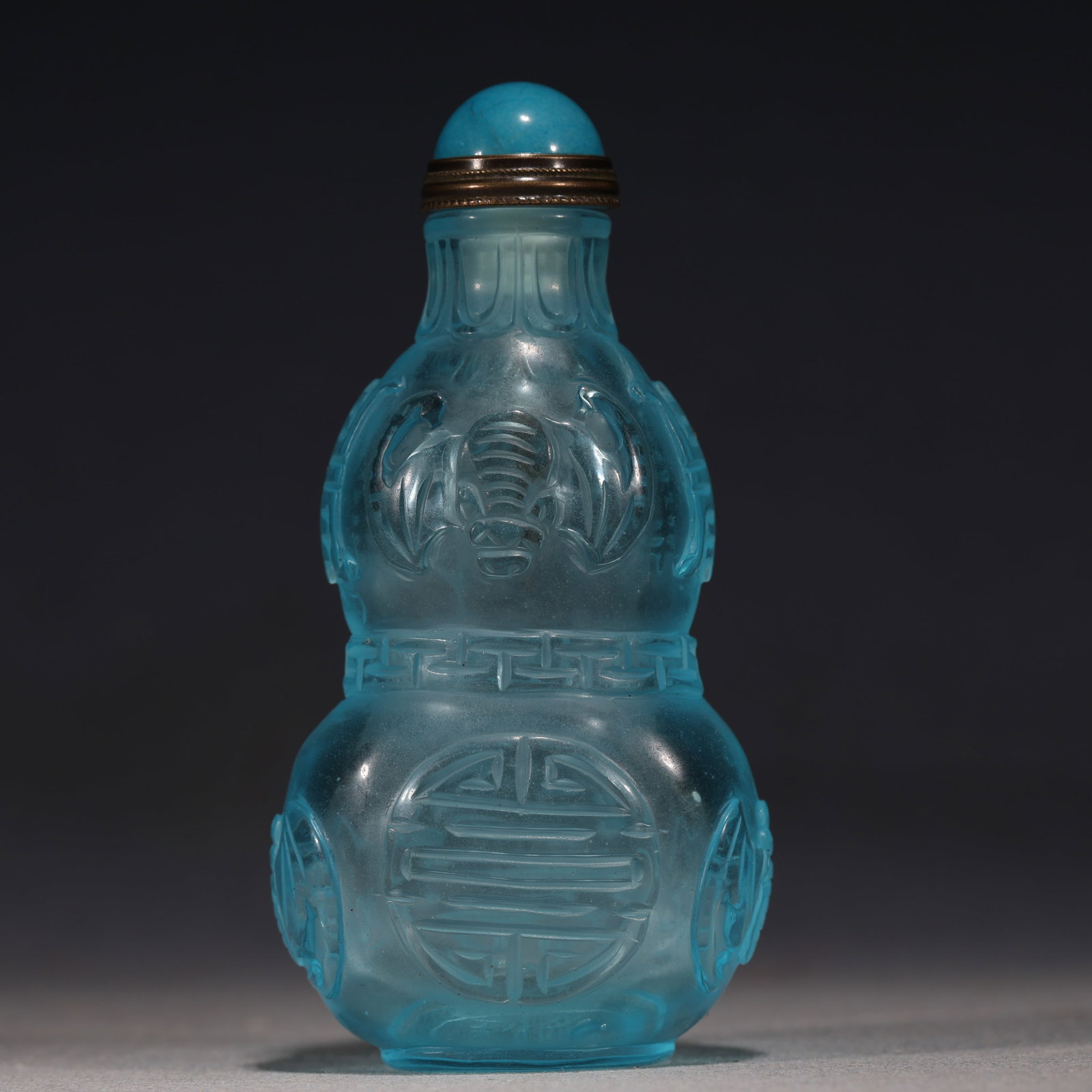 An Exquisite Sky-blue Glass Relief Interlocking Chilong Dragon Pattern Snuff Bottle: An Exquisite Sky-blue Glass Relief Interlocking Chilong Dragon Pattern Snuff Bottle,Qing Dynasty,China,Qianlong Four-character Mark,Size:2.4in×1.2in×3.1in 天蓝琉璃