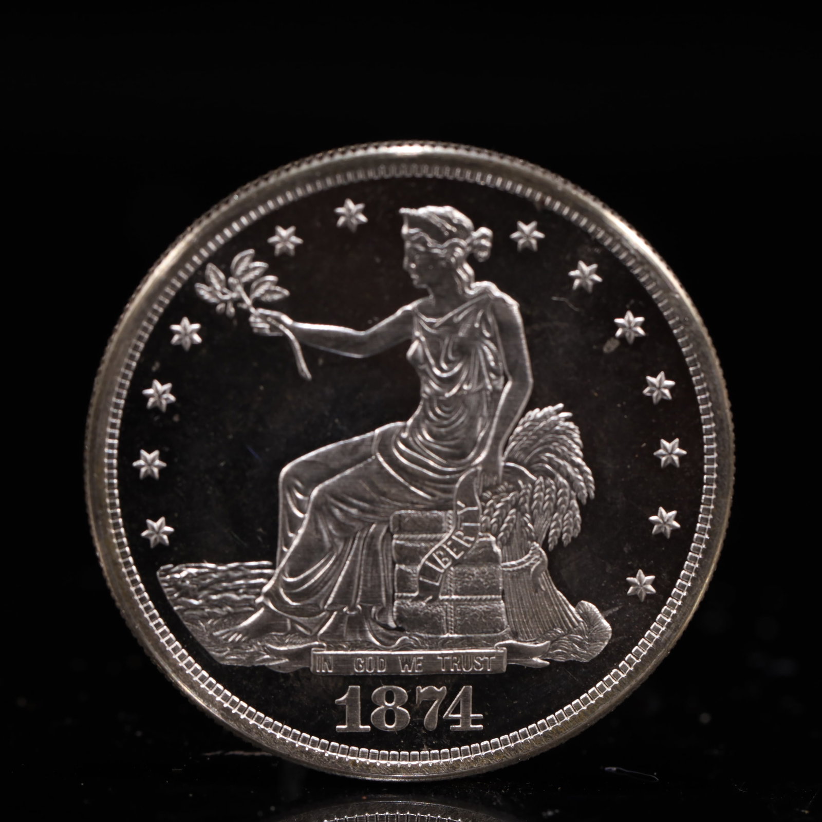 USA Trade Dollar 1874 Coin: American coin. Obverse: Liberty seated on a pedestal facing the sea to the left holding olive branches surrounded by 13 stars. IN GOD WE TRUST / LIBERTY / 1874. Reverse: An eagle holding branches with