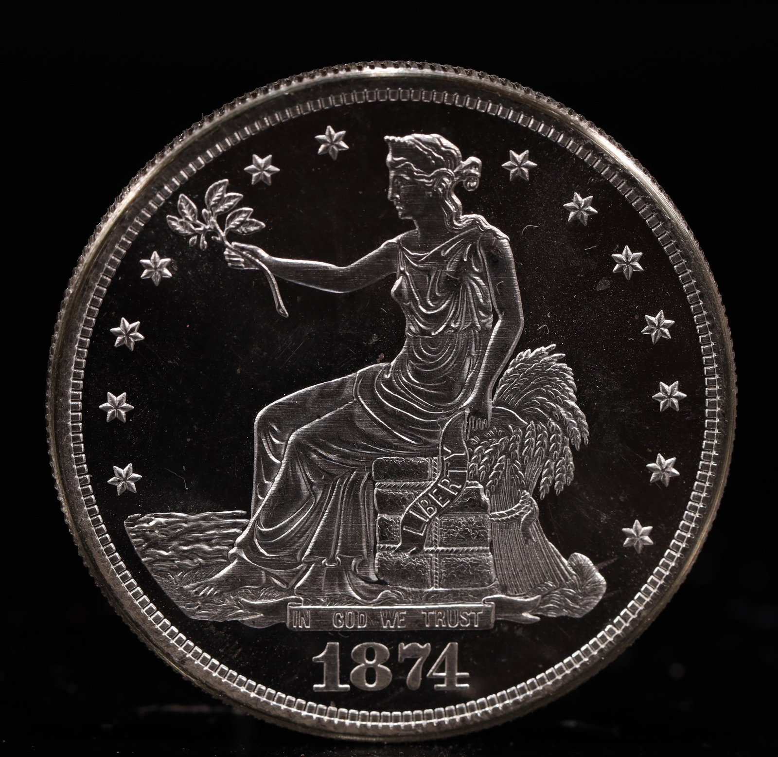 USA Trade Dollar 1874 Coin: American coin. Obverse: Liberty seated on a pedestal facing the sea to the left holding olive branches surrounded by 13 stars. IN GOD WE TRUST / LIBERTY / 1874. Reverse: An eagle holding branches with