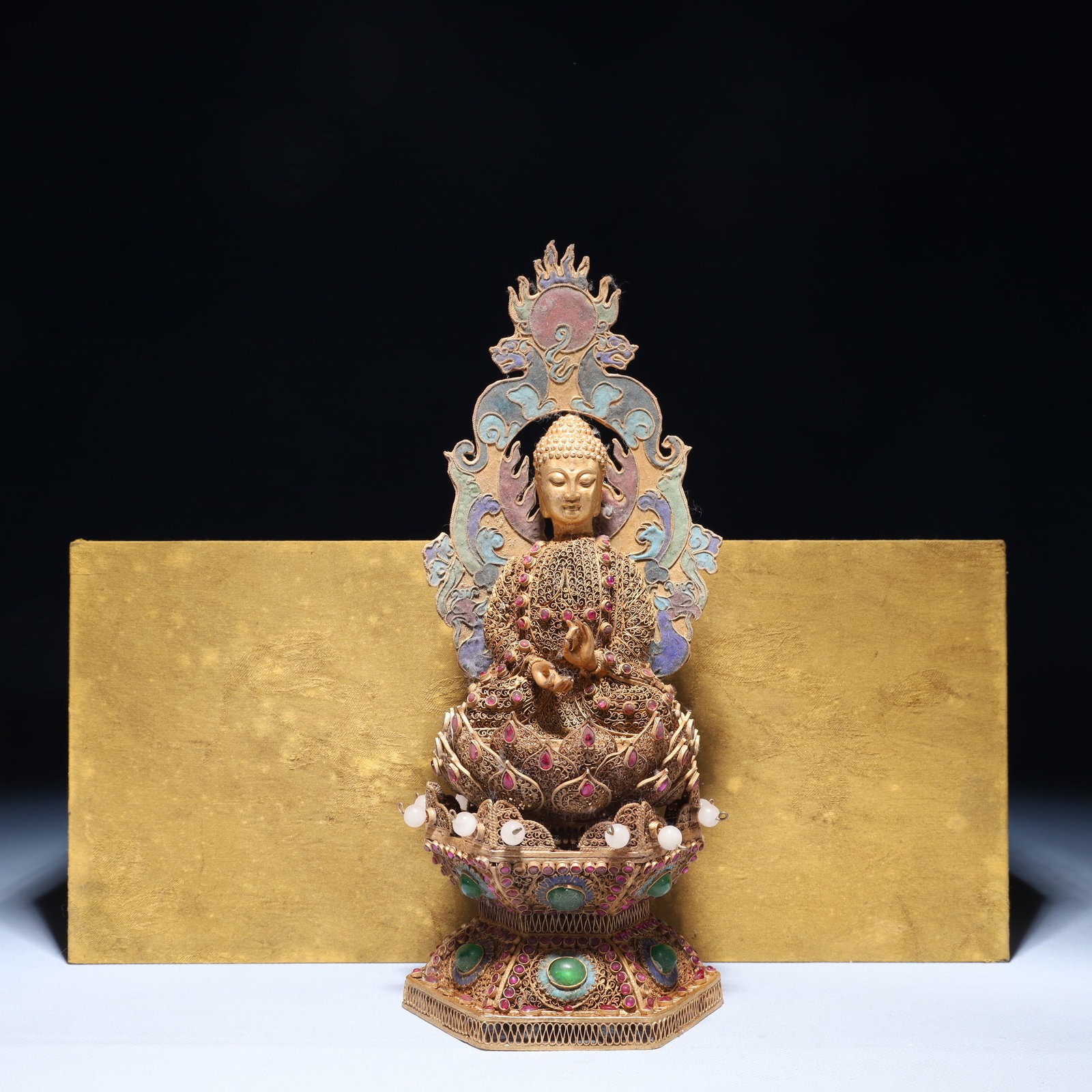 An Exquisite Filigree and Gilding Buddha Statue, Inlaid Gems: An Exquisite Filigree and Gilding Buddha Statue, Inlaid Gems, Qing Dynasty,China, Qianlong Four-character Mark, Size:4.7inx11in,(Box)15inx7.9inx6.7in,Weight:750g