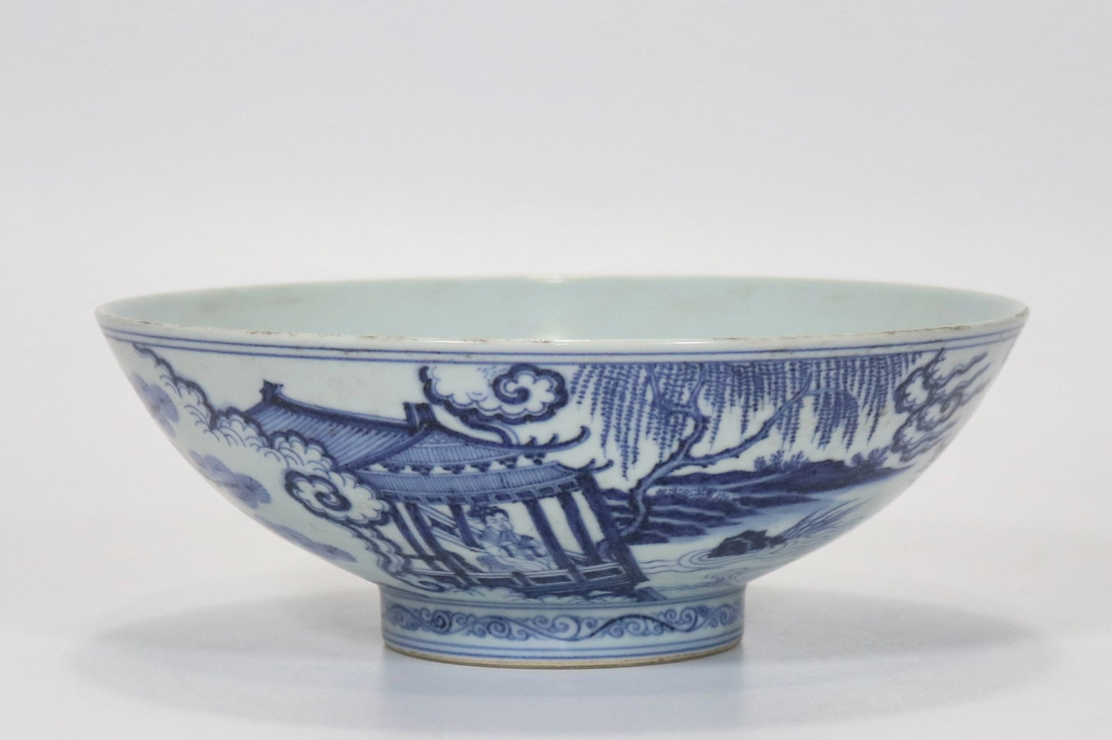 A fine blue and white bowl depicting playing flute to attract phoenix scene (1 of 8)