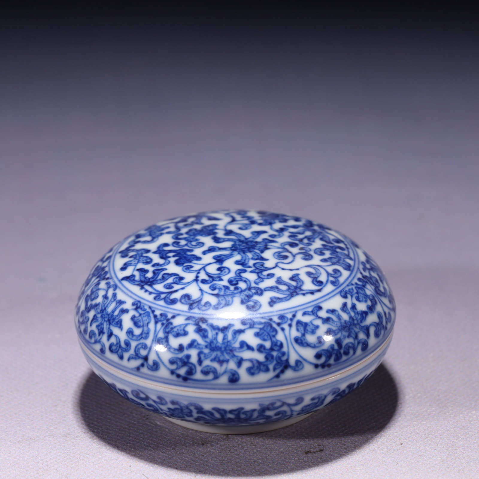 An Exquisite Blue and White Lotus Pattern Box with Cover: An Exquisite Blue and White Lotus Pattern Box with Cover,Qing Dynasty,China,Qianlong Six-character Mark,Size:3.3inx1.4in,Weight:149g 青花缠枝莲纹盖盒,&#