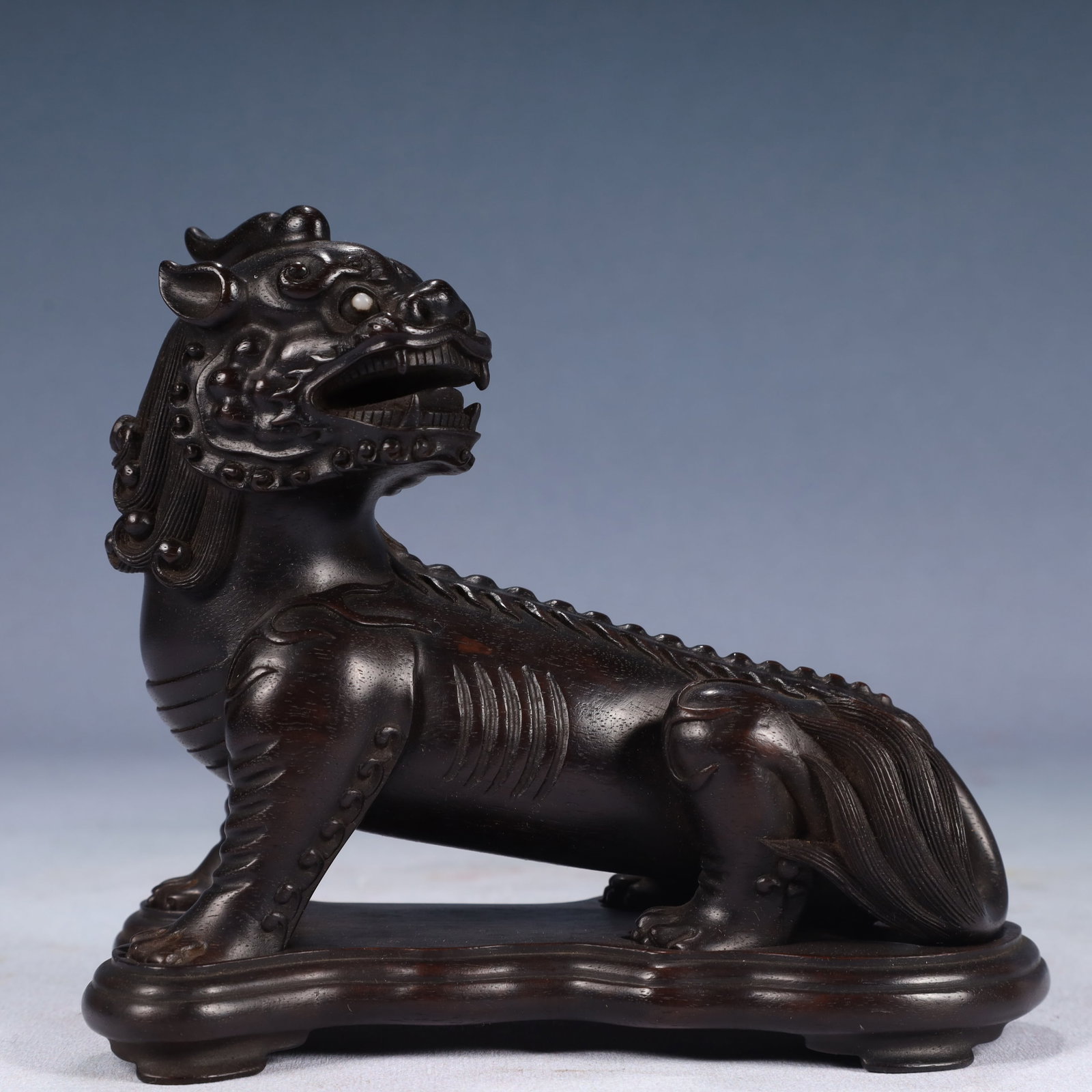 An Exquisite Zitanwood Lion Ornament,With Base: An Exquisite Zitanwood Lion Ornament,With Base,Qing Dynasty, China,Size:6.7inx3.5inx5.7in,Weight:450g 紫檀木狮子摆件,带底座,中国