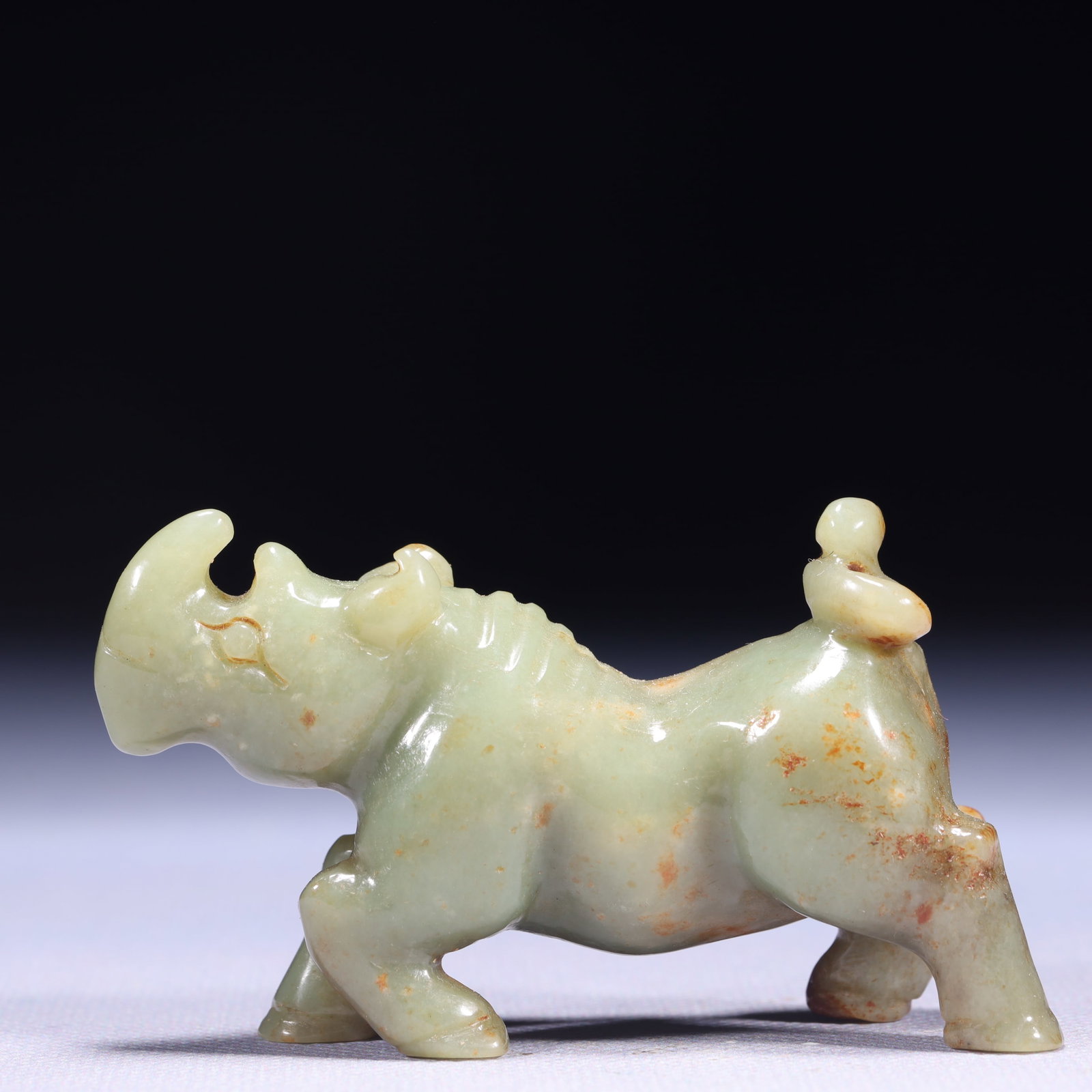 An Exquisite White Jade Rhinoceros Ornament: An Exquisite White Jade Rhinoceros Ornament,Qing Dynasty,China,Size:3.1inx0.8inx1.8in,Weight:111g 白玉犀牛摆件,中国清代