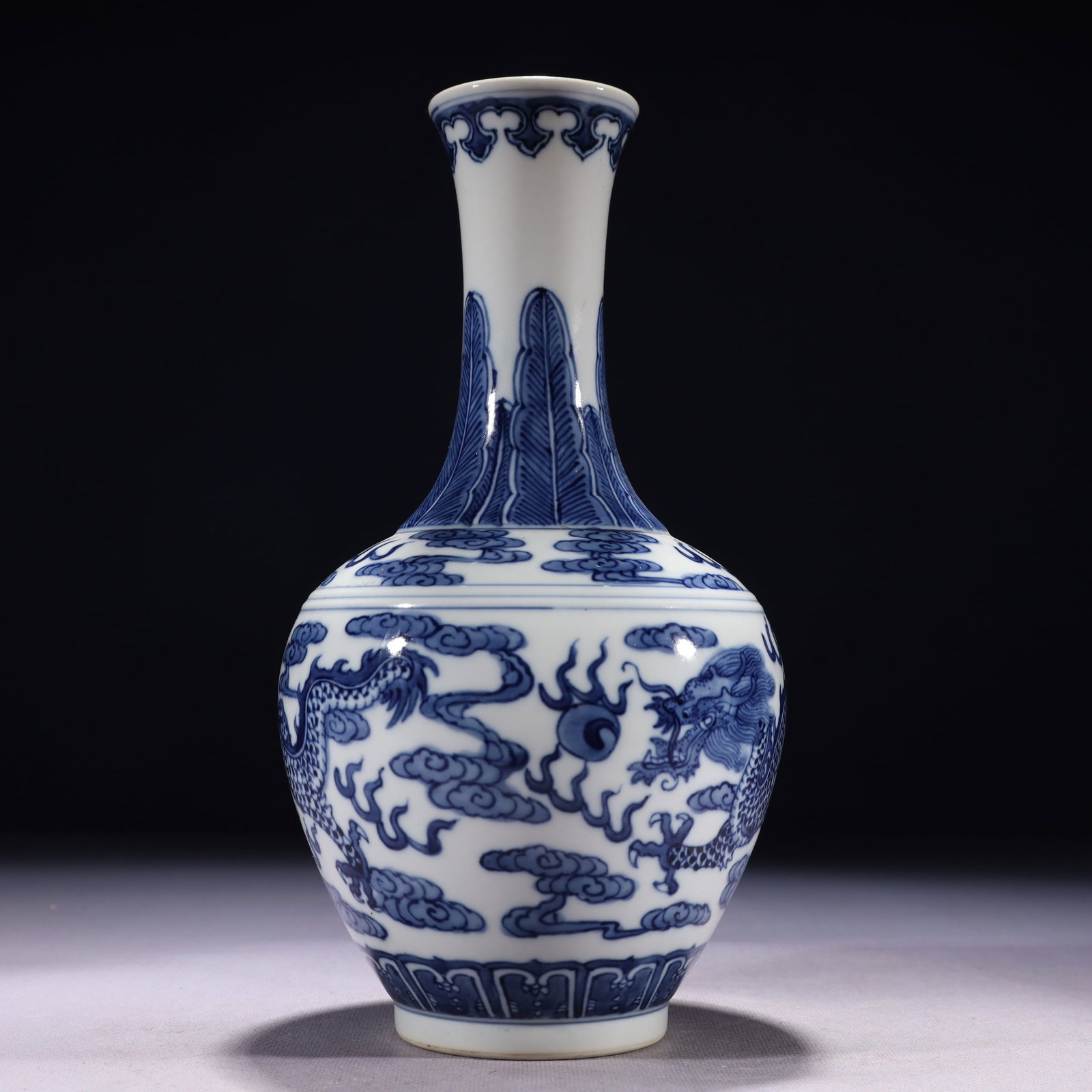 An Exquisite Blue and White Auspicious Cloud and Dragon Pattern Vase: An Exquisite Blue and White Auspicious Cloud and Dragon Pattern Vase,Qing Dynasty,China,Kangxi Six-character Mark,Size:5.1inx10.6in,Weight:750g 青花祥云龙纹瓶