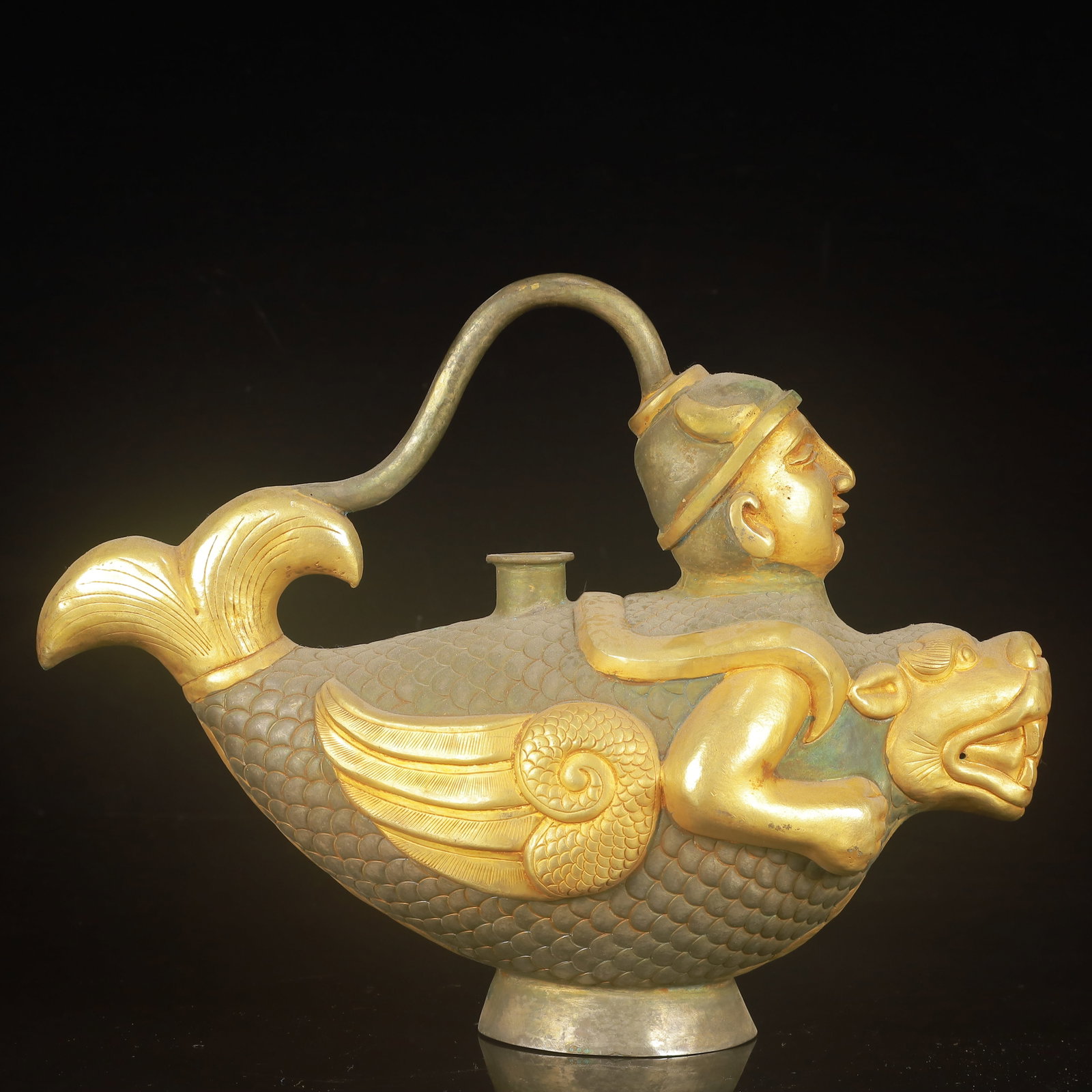 An Exquisite Gilt Silver Figure Pattern Auspicious Beast Ewer: An Exquisite Gilt Silver Figure Pattern Auspicious Beast Ewer,Tang Dynasty,China,Zhenguan Four-Character Mark,Size:11.8inx5.1inx9.1in,Weight:1050g