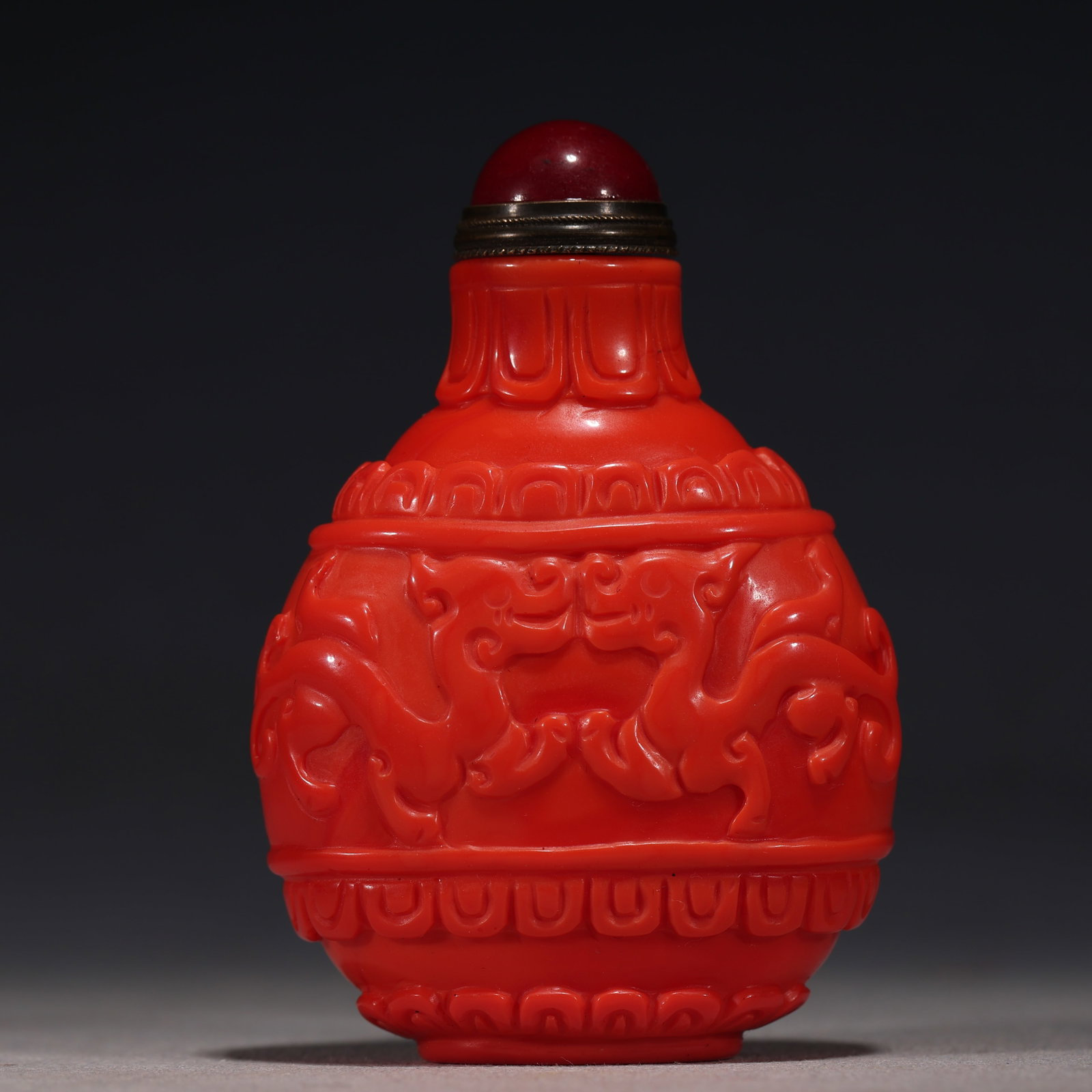 An Exquisite Coral Red Glass Pair of Chilong Dragons Lotus Petal Pattern Snuff Bottle: An Exquisite Coral Red Glass Pair of Chilong Dragons Lotus Petal Pattern Snuff Bottle,Qing Dynasty, China,Yongzheng Four-character Mark,Size:2.2in×1.2in×3.1in 珊瑚红琉