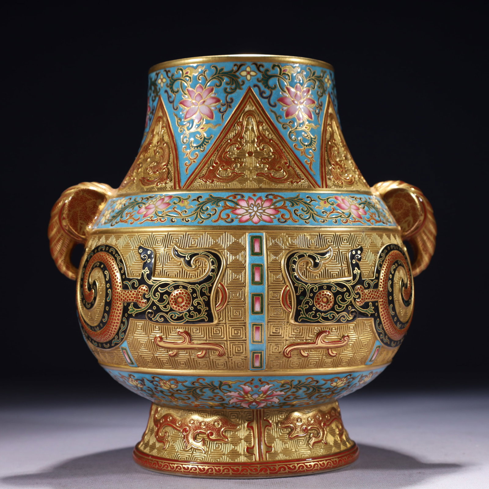 An Exquisite Gold Ground Famille-Rose Lotus Pattern Elephant-Ears Vase: An Exquisite Gold Ground Famille-Rose Lotus Pattern Elephant-Ears Vase,Qing Dynasty,China,Qianlong Six-character Mark,Size:8.3inx9.4in,Weight:2150g 金地粉彩缠枝!