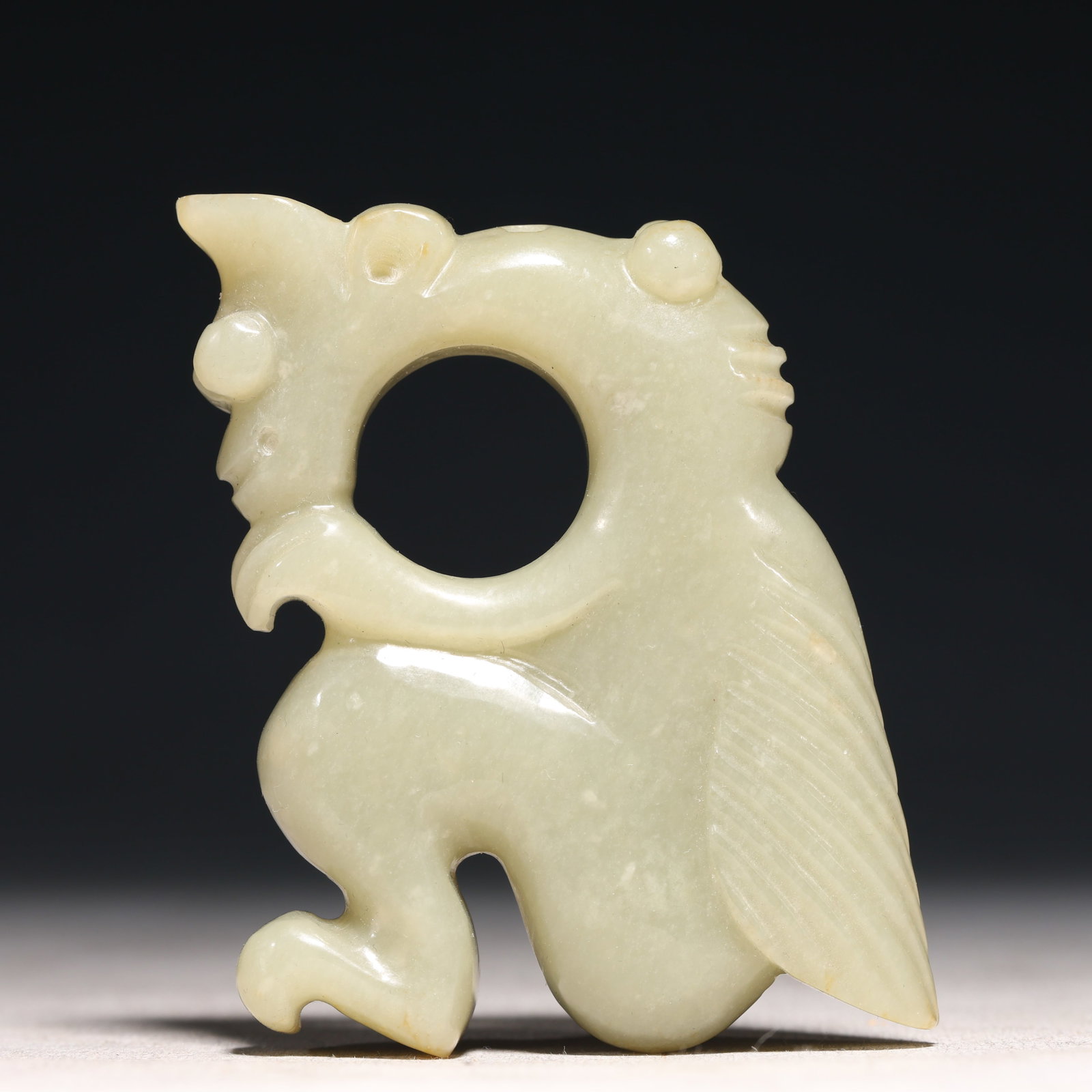 A Rare White Jade Auspicious Beast Ornament: A Rare White Jade Auspicious Beast Ornament,Chinese Qing Dynasty,China,Size:2.6inx3.1in,Weight: 174g 白玉瑞兽摆件,清代