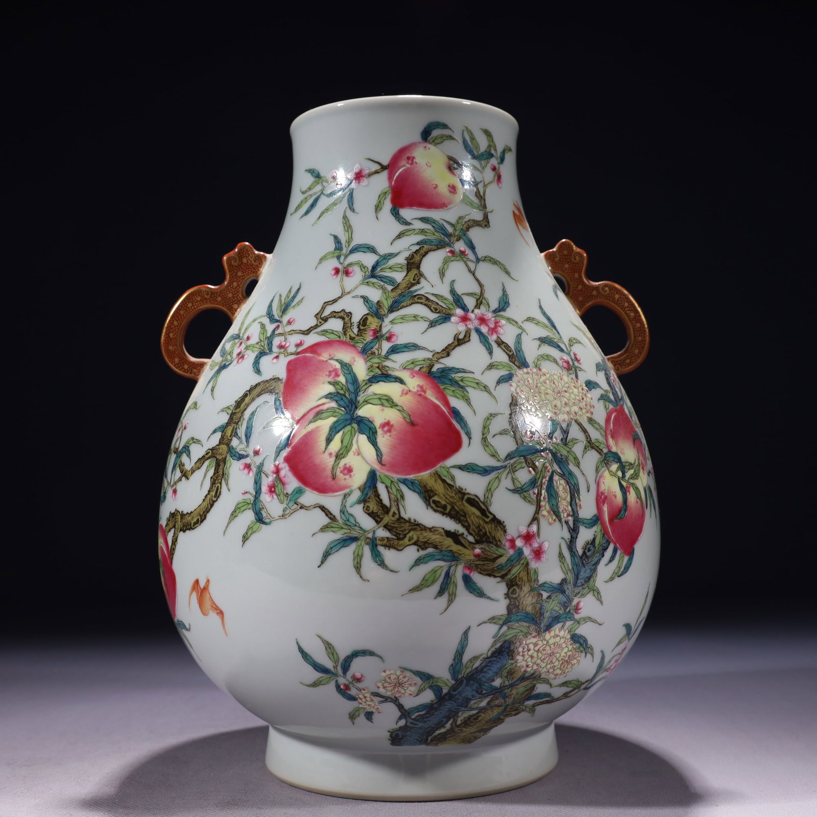 An Exquisite Famille-Rose Bats and Peach Pattern Double-Ears Vase: An Exquisite Famille-Rose Bats and Peach Pattern Double-Ears Vase,Qing Dynasty,China,Qianlong Six-character Mark,Size:7.5inx10.6in,Weight:2300g 粉彩福寿纹双耳