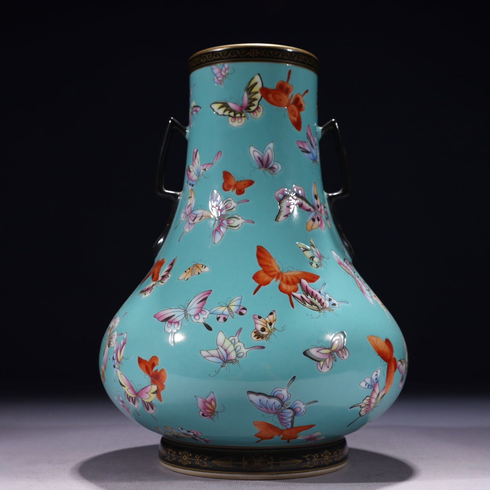 An Exquisite Turquoise Glazed Famille-Rose Painted Gold Butterfly Pattern Double-Ears Vase: An Exquisite Turquoise Glazed Famille-Rose Painted Gold Butterfly Pattern Double-Ears Vase,Qing Dynasty,China,Yongzheng Mark,Size:6.7inx9.8in,Weight:1650g 松石绿釉粉ô