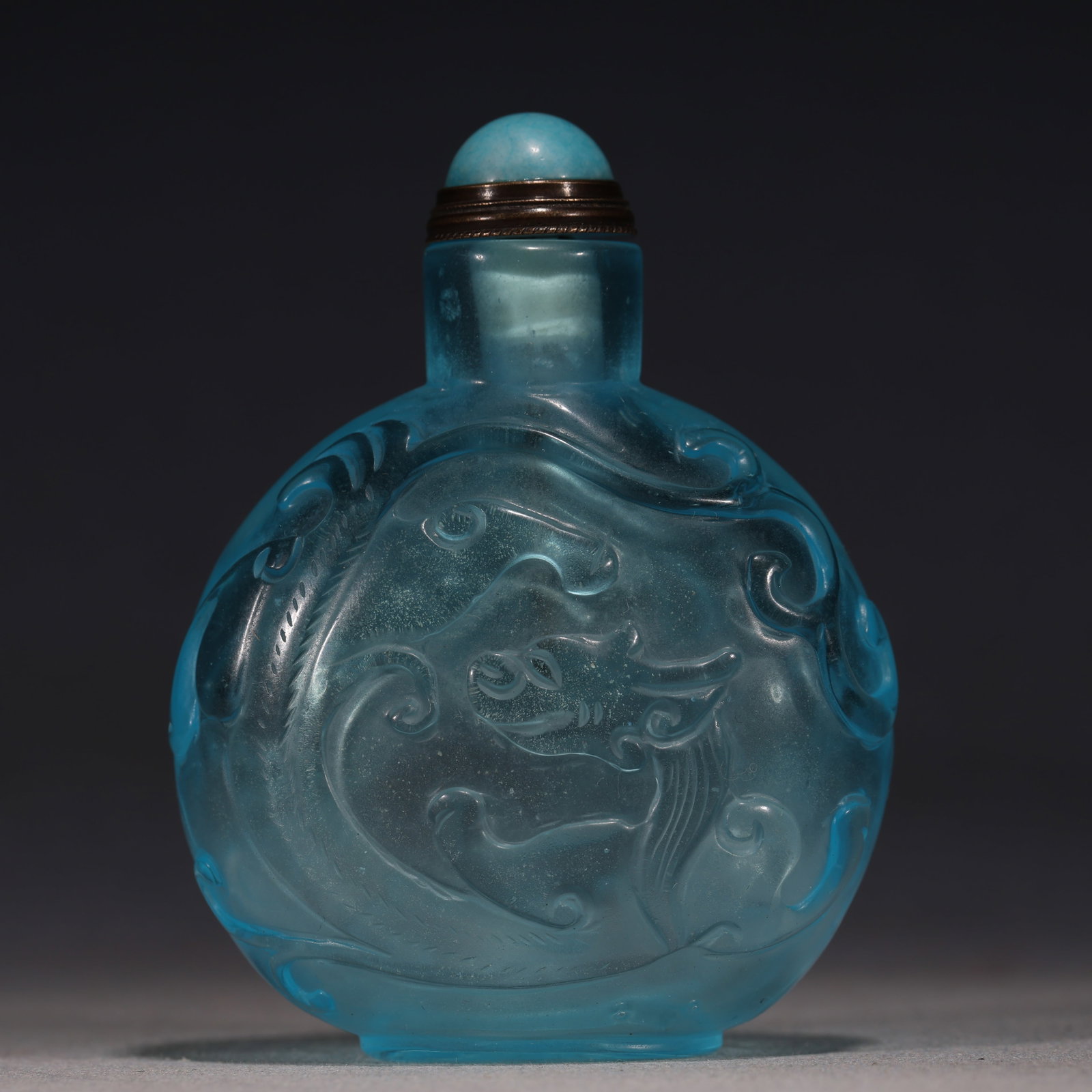 An Exquisite Sky-blue Glass Relief Interlocking Chilong Dragon Pattern Snuff Bottle: An Exquisite Sky-blue Glass Relief Interlocking Chilong Dragon Pattern Snuff Bottle,Qing Dynasty, China,Qianlong Four-character Mark,Size:2.4in×1.2in×3.1in 天蓝琉璃&#