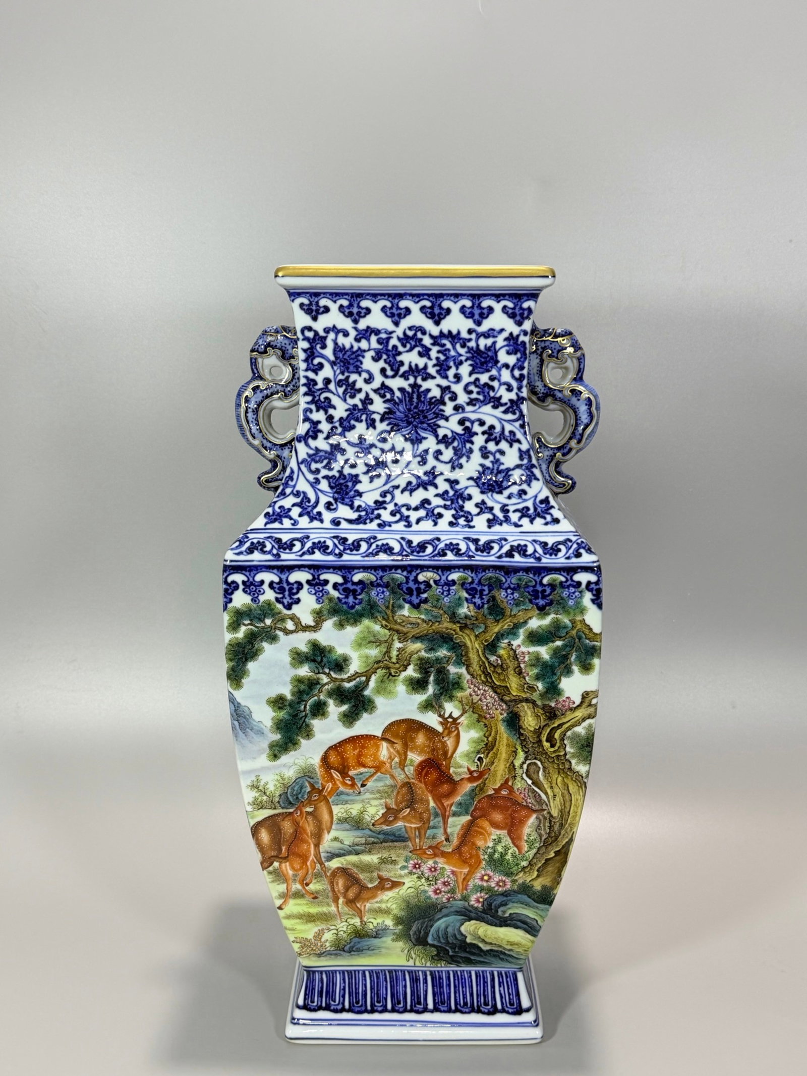 A Huge Blue and White Famille-Rose Painted Gold Pine and Deer Pattern Double-Ears Vase: A Huge Blue and White Famille-Rose Painted Gold Pine and Deer Pattern Double-Ears Vase,Qing Dynasty,China,Qianlong Six-character Mark,Size:16.9inx7.7in 青花粉彩描金