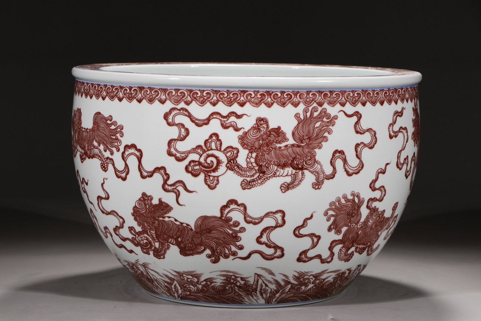 An Exquisite Underglaze-Red Lion Pattern Vat: An Exquisite Underglaze-Red Lion Pattern Vat,Qing Dynasty,China,Qianlong Six-character Mark,Size:9.6inx14.5in