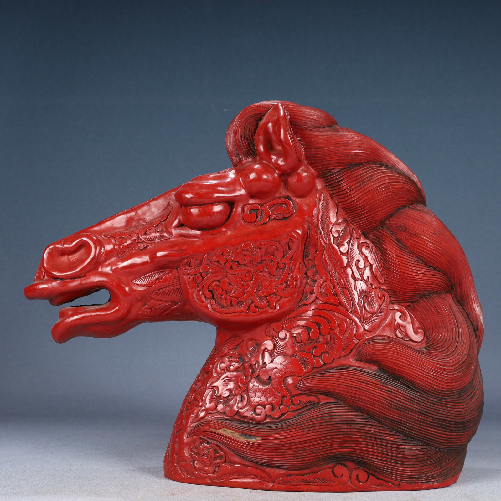 A Rare Carved Red Lacquer Lotus and Dragon Pattern Horse-head Ornament: A Rare Carved Red Lacquer Lotus and Dragon Pattern Horse-head Ornament,Qing Dynasty, China,Size:15.4inx4.3inx13in,Weight:2850g 剔红漆缠枝莲龙纹马&