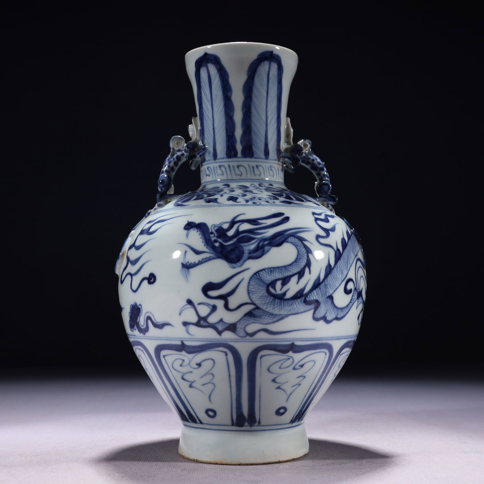 An Exquisite Blue and White Auspicious Cloud and Dragon Pattern Double-Ears Vase: An Exquisite Blue and White Auspicious Cloud and Dragon Pattern Double-Ears Vase,Qing Dynasty,China,Size:5.5inx9.4in,Weight:1100g 青花祥云龙纹双耳ல