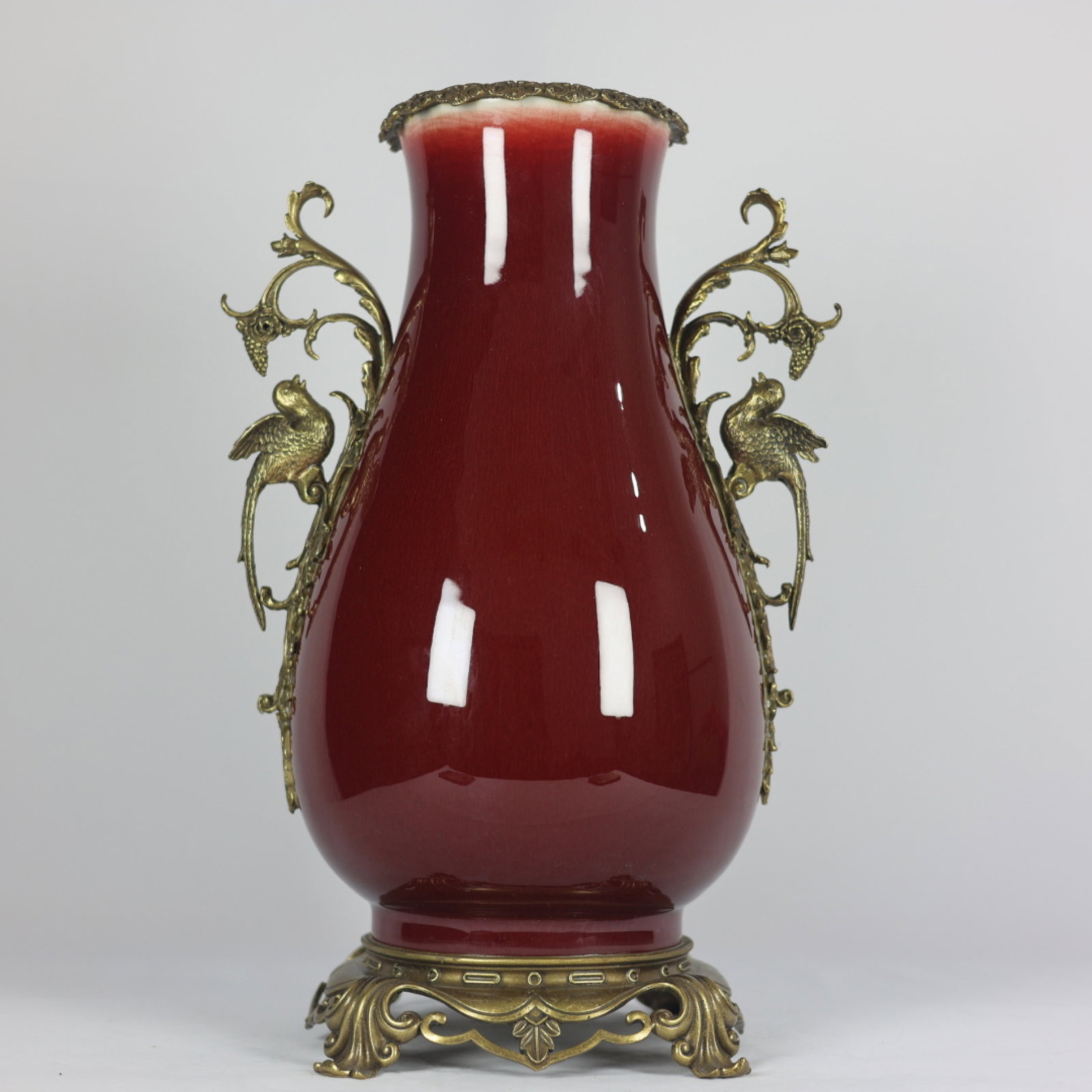 A Huge Red Glazed Inlaid Bronze Double-Ears Vase: A Huge Red Glazed Inlaid Bronze Double-Ears Vase,Qing Dynasty,China,Qianlong Six-character Mark,Size:17.7inx11.4in 红釉镶铜双耳瓶,中国清