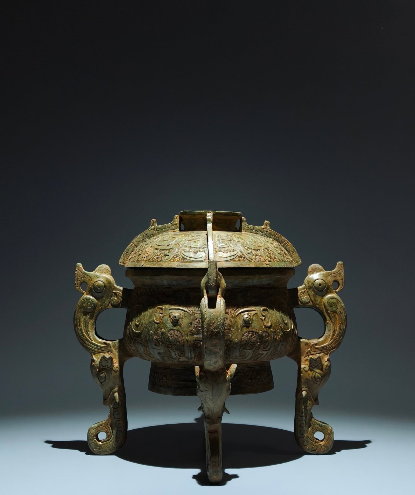 An Archaic Bronze Elephant Pattern Beast-Ears Tripod Food Vessel,With Inscription: An Archaic Bronze Elephant Pattern Beast-Ears Tripod Food Vessel,With Inscription,W.Zhou,China,Size:11.8inx13inx8.1in 青铜象纹兽耳三足食器,&