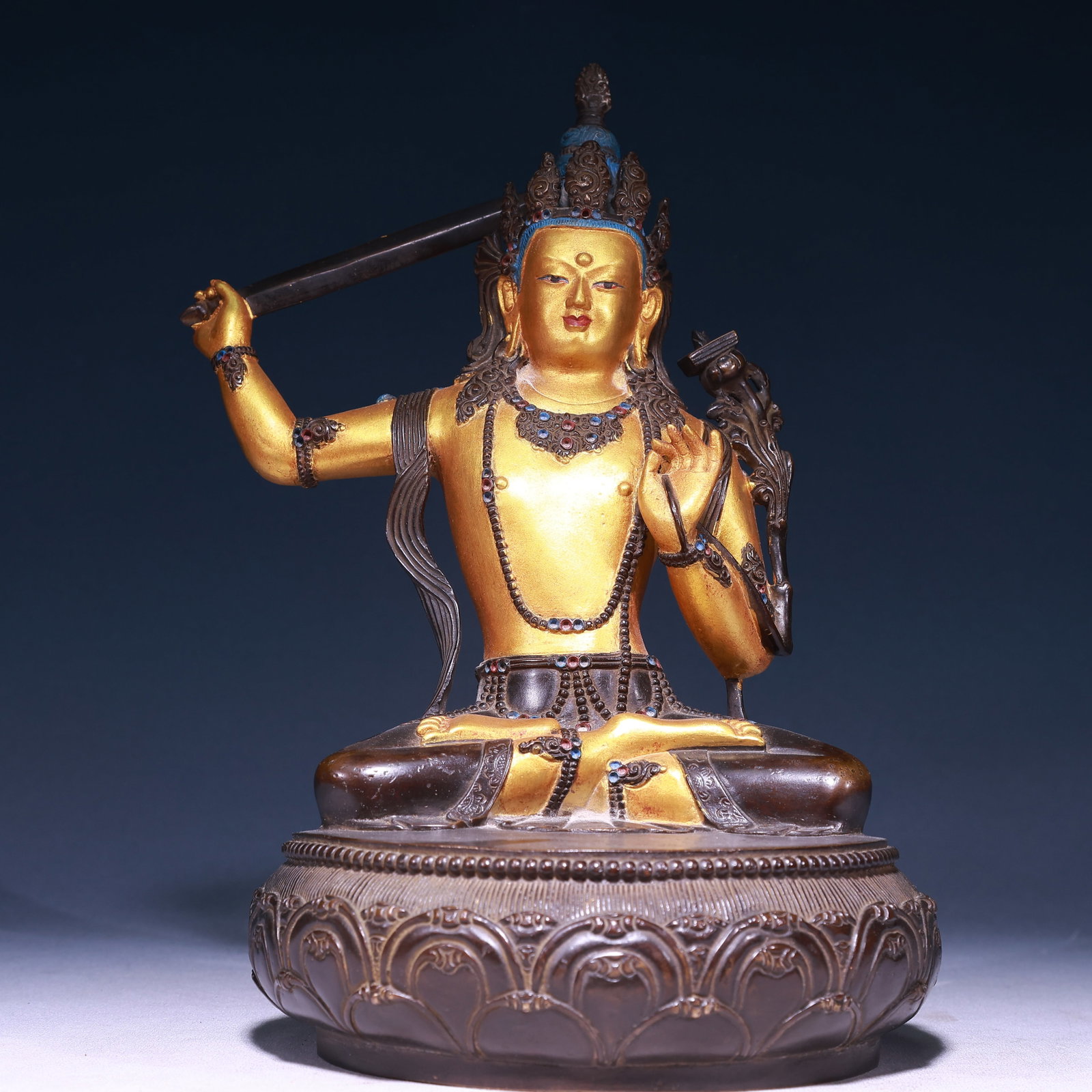 A Solemn Gilt Bronze Statue of Manjusri: A Solemn Gilt Bronze Statue of Manjusri,Ming Dynasty,China,Yongle Six-character Mark,Size:7.5inx12.2in,Weight:6200g 铜鎏金文殊菩萨像,中国