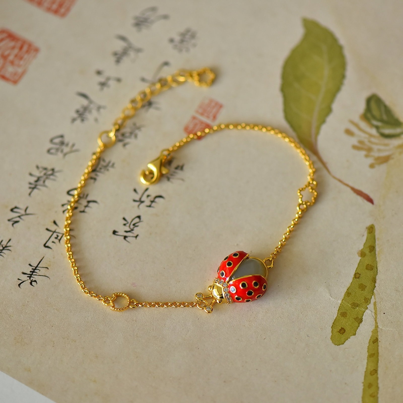 An Exquisite Sterling Silver-Gold Plated Inlaid White Jade Enamel Bracelets: An Exquisite Sterling Silver-Gold Plated Inlaid White Jade Enamel Bracelets 纯银镀金镶白玉珐琅手链