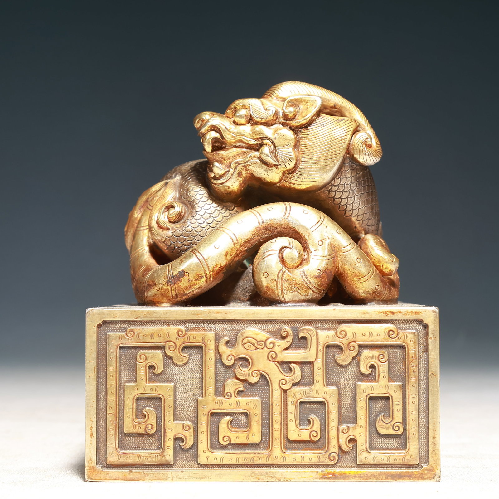 An Exquisite Gilt Bronze Chi-Dragon Pattern Seal: An Exquisite Gilt Bronze Chi-Dragon Pattern Seal,Qing Dynasty, China,Size:4.7inx5.9in,Weight:9700g 铜鎏金螭龙纹印章,中国清代