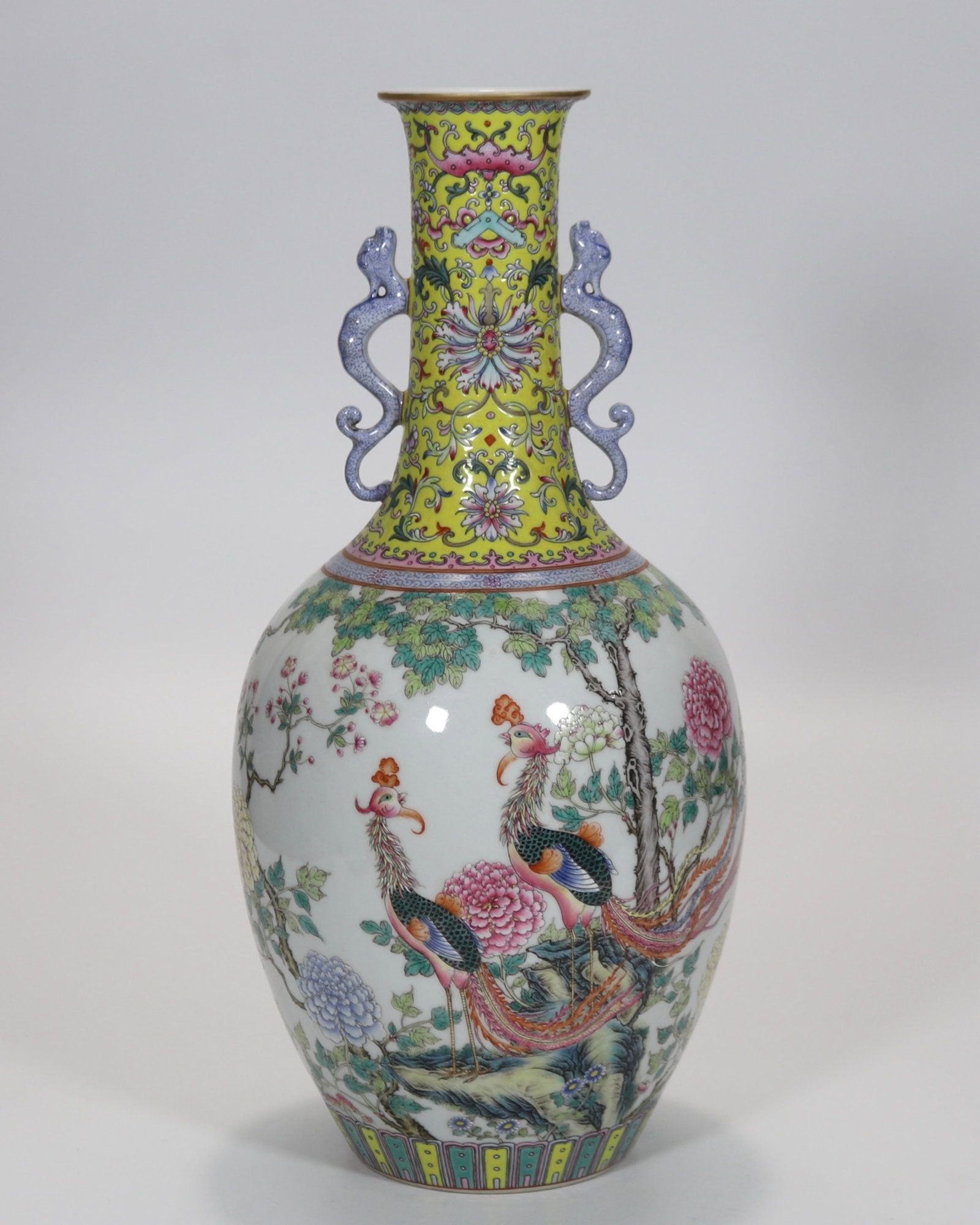 A fine famille rose phoenix through peony double-handled vase: A fine famille rose phoenix through peony double-handled vase, Qing Dynasty, China, with six-character Qianlong reign mark, Size:14inx2.7in 粉彩凤穿牡丹纹