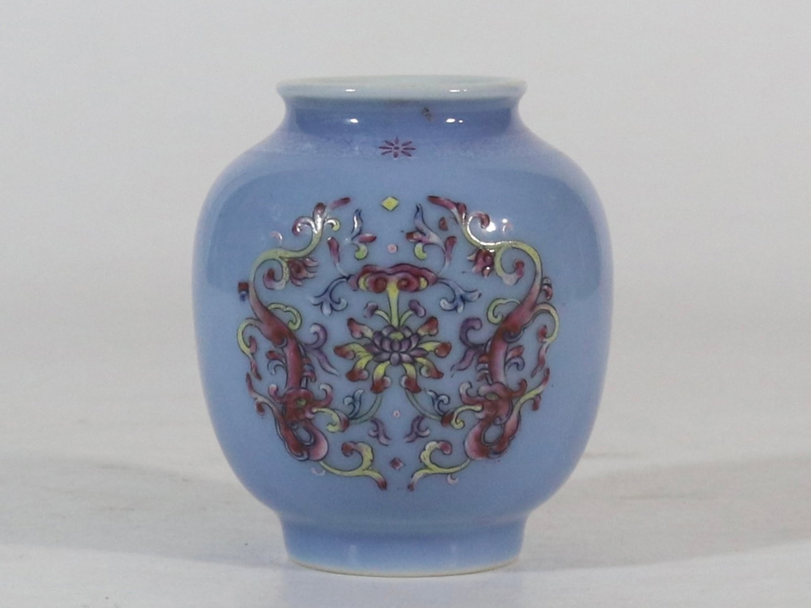 An Exquisite Blue Ground Famille-Rose Flower and Dragon Pattern Jar: An Exquisite Blue Ground Famille-Rose Flower and Dragon Pattern Jar,Qing Dynasty,China,Yongzheng Six-character Mark,Size:3.3inx1.7in