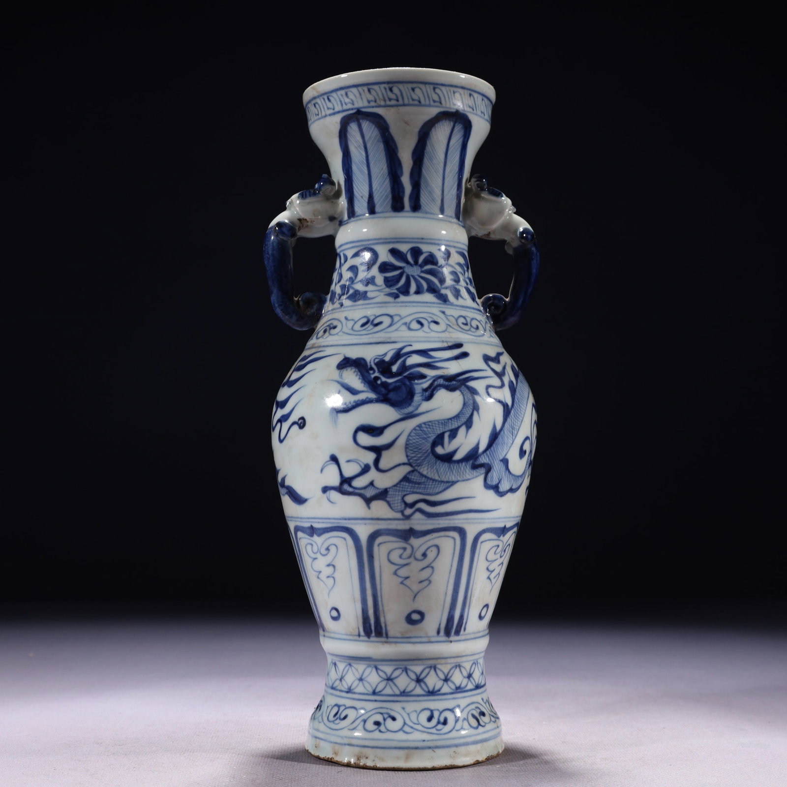 An Exquisite Blue and White Auspicious Cloud and Dragon Pattern Double-Ears Vase: An Exquisite Blue and White Auspicious Cloud and Dragon Pattern Double-Ears Vase,Qing Dynasty,China,Size:3.9inx10.2in,Weight:850g