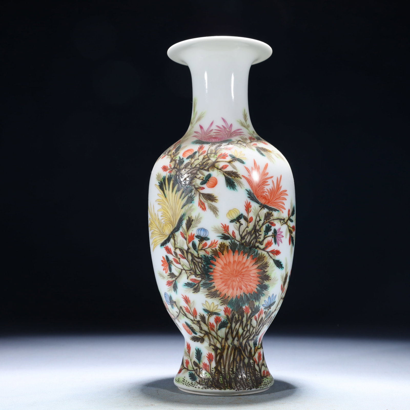 An Archaic Hongshan Culture Yellow Jade Figure Ornament: A white-ground famille-rose vase painted with a blooming chrysanthemum spray, the reverse inscribed with a poetic couplet in iron-red. The enamel colours are softly elegant and the brushwork refined.