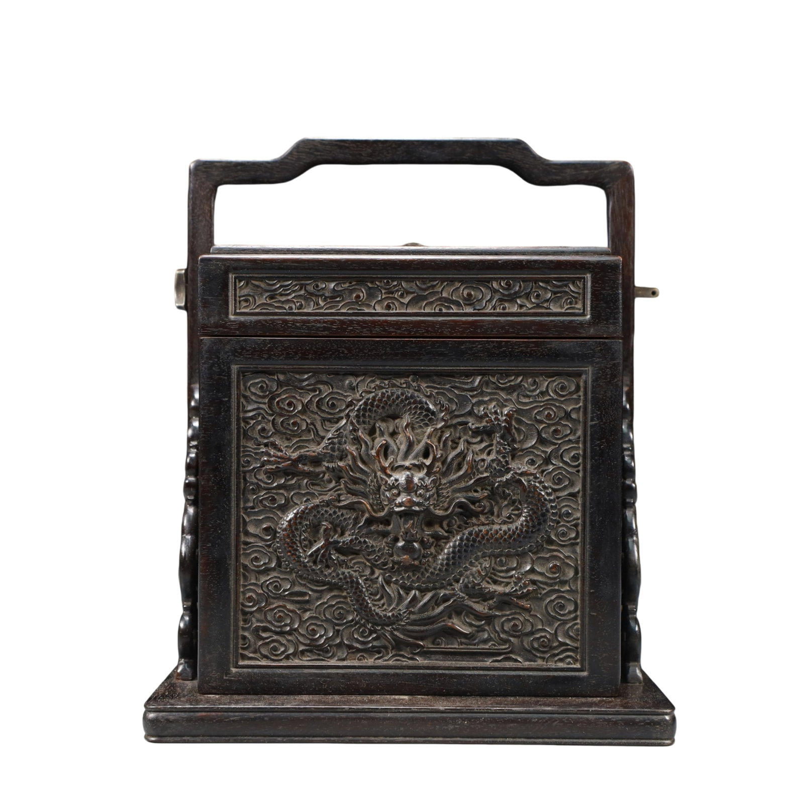 An Exquisite White Jade Double-Ears Cup: A rectangular box and cover of zitan wood, the top carved in relief with a five-clawed dragon pursuing a flaming pearl amidst auspicious clouds, the sides with classic scroll borders. 紫檀