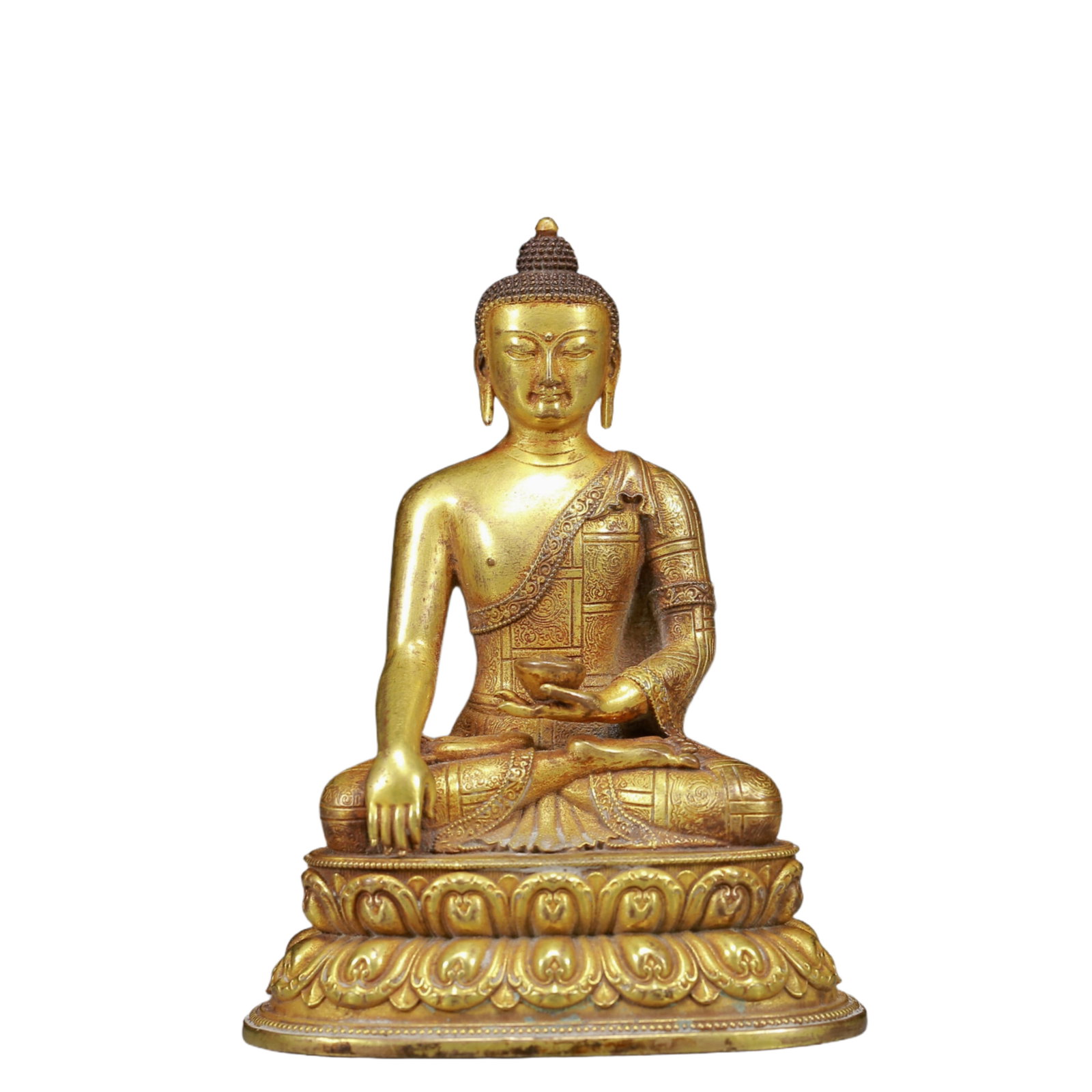 A Solemn Gilt Bronze Dragon Pattern Statue of Sakyamuni: A Solemn Gilt Bronze Statue of Sakyamuni,Ming Dynasty, China,Size:3inx2.2inx3.9in,Weight:370g 铜鎏金释迦摩尼像，明代