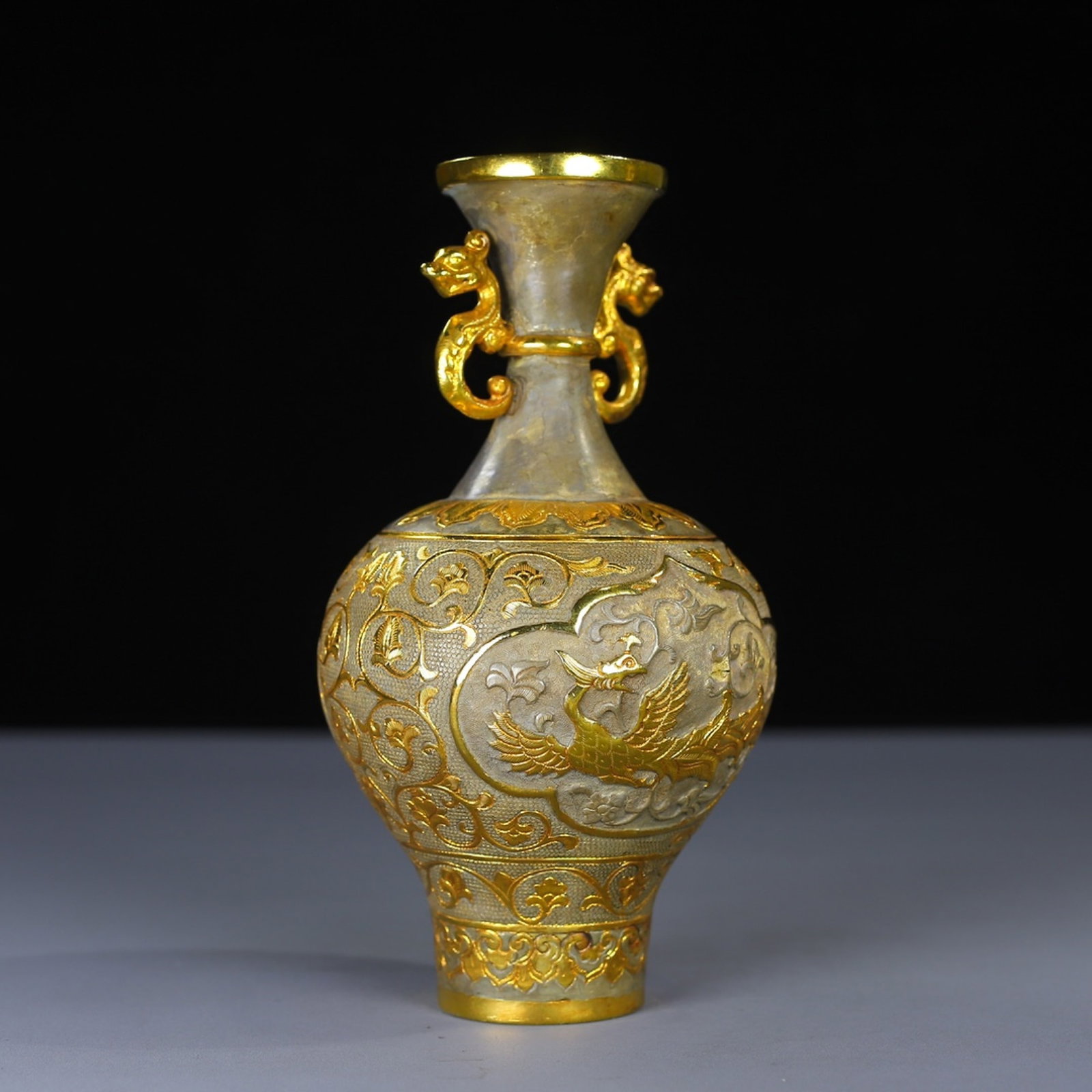 An Exquisite White Jade Beast-head Brush Washer: An Exquisite Gilt Bronze Lotus and Phoenix Pattern Dragon-Ears Vase,Tang Dynasty,China,Zhenguan Four-character Mark,Size:6.7inx3.1in,Weight:305g