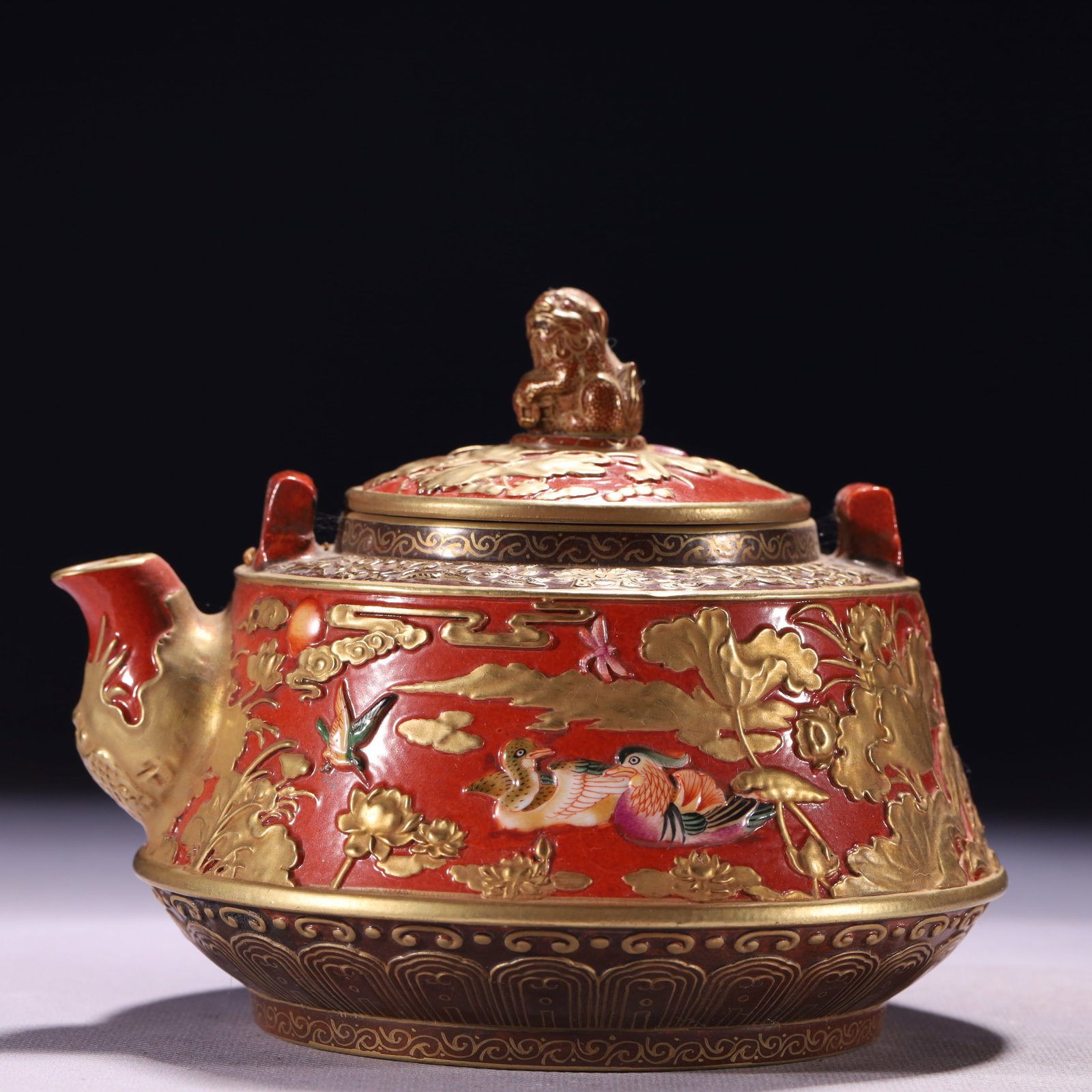 A Solemn Bronze Inlaid Silver Four-arms Buddha Statue: An Exquisite Gold Ground Red Glazed Flower and Mandarin Duck Pattern Teapot,Qing Dynasty,China,Qianlong Six-character Mark,Size:5.5inx4.3in,Weight:919g 金地红釉花卉