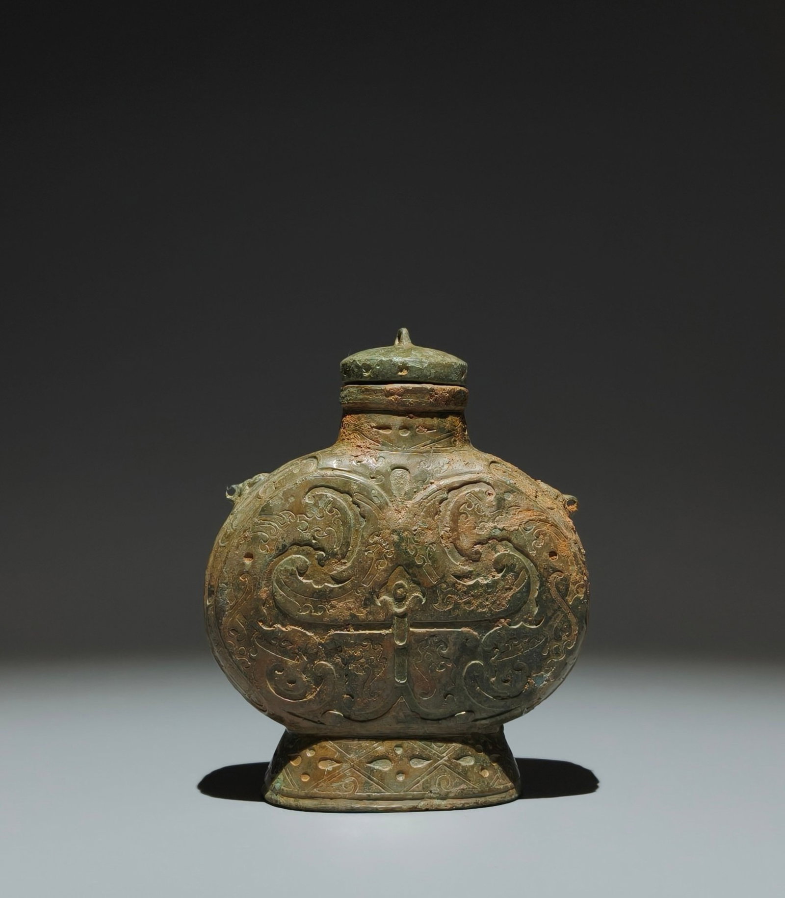 A Pair of Exquisite Famille-Rose Lotus Pattern Eight Treasures Pattern Stem Cup: An Archaic Bronze Coiled-Dragon Pattern Beast-Ears Pot,the Warring States period in China,Size:5.9inx4.7inx2.2in 青铜蟠龙纹兽耳壶,中国৏