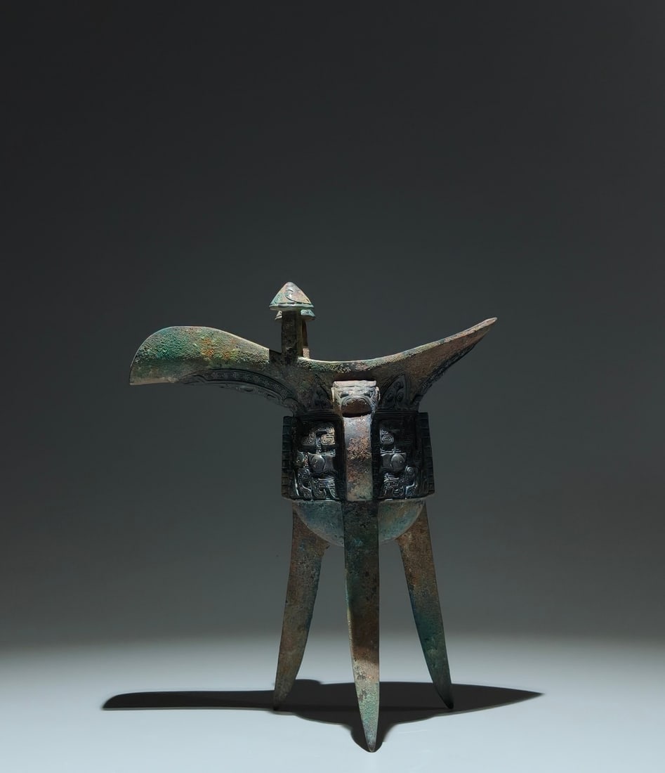 A Huge Enamel Gilt Flower and Butterfly Pattern Vase: An Archaic Bronze Beast-Face Pattern Tripod Goblet,Sang Dynasty,China,Size:8.9inx7.5inx4.3in 青铜兽面纹三足爵杯,中国商代