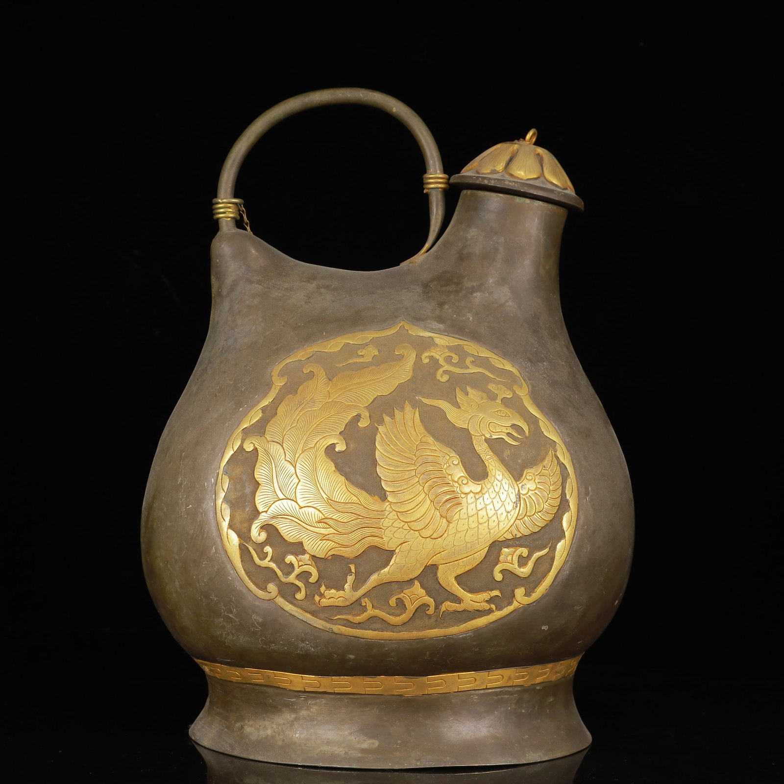 An Exquisite Guan yao Celadon Glazed Censer: An Exquisite Gilt Silver Phoenix Pattern Ewer,Qing Dynasty,China,Size:8.7inx6.3inx12.6in,Weight:2250g 银鎏金凤纹提壶,中国清代
