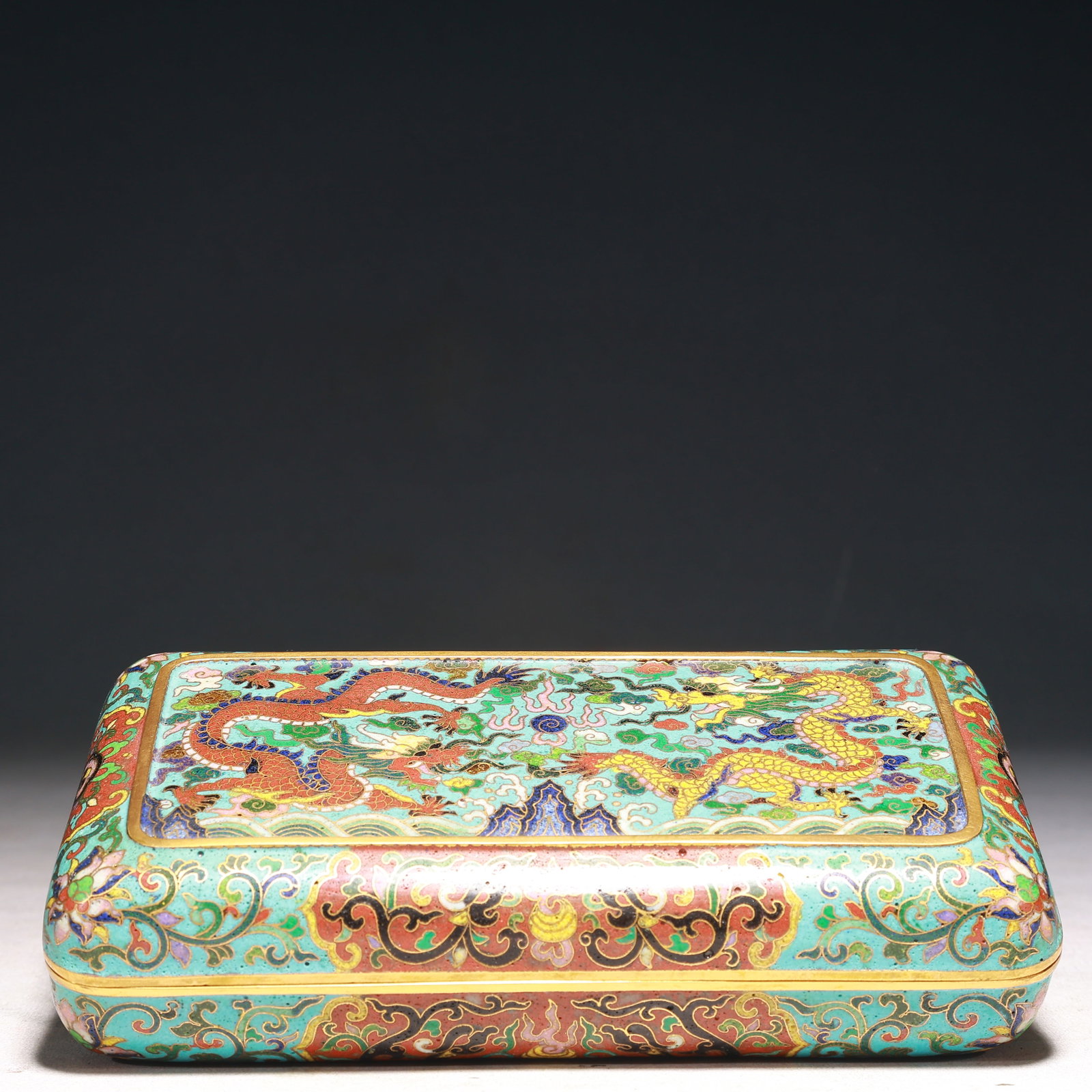 An Exquisite Iron-Red Painted Gold Flower and Fish Pattern Bowl: An Exquisite Cloisonne Lotus,Auspicious Cloud and Dragon Pattern Box with Cover,Qing Dynasty,China,Qianlong Six-character Mark,Size:7.5inx3.9inx2in,Weight:1100g 景泰蓝缠枝
