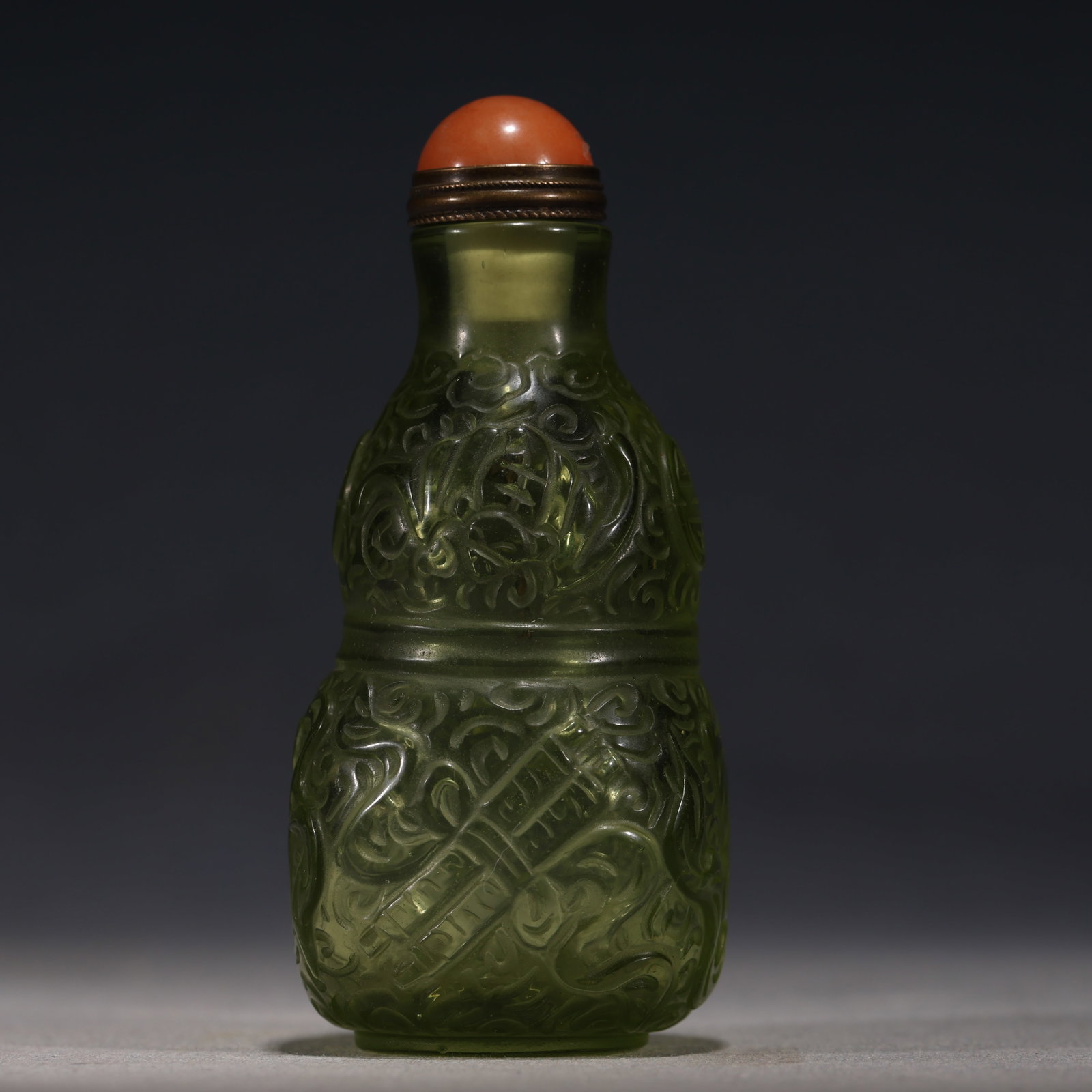 An Exquisite Greenish Jade Statue of Avalokitesvara Pendant: An Exquisite Green Glass Interlocking Round Longevity Character Pattern Snuff Bottle,Qing Dynasty, China,Qianlong Four-character Mark,Size:1.4in×1.4in×3.1in 绿色琉璃&