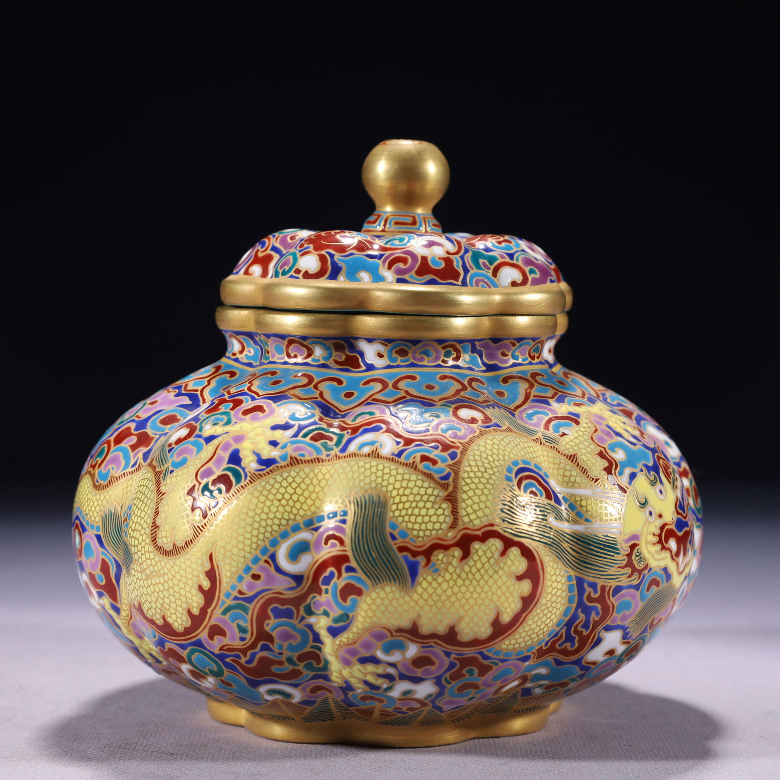 An Exquisite Enamel Gold Ground Dragon and Phoenix Pattern Jar with Cover: An Exquisite Enamel Gold Ground Dragon and Phoenix Pattern Jar with Cover,Qing Dynasty,China,Qianlong Four-character Mark,Size:5.5inx5.9in,Weight:750g 珐琅彩金地龙&