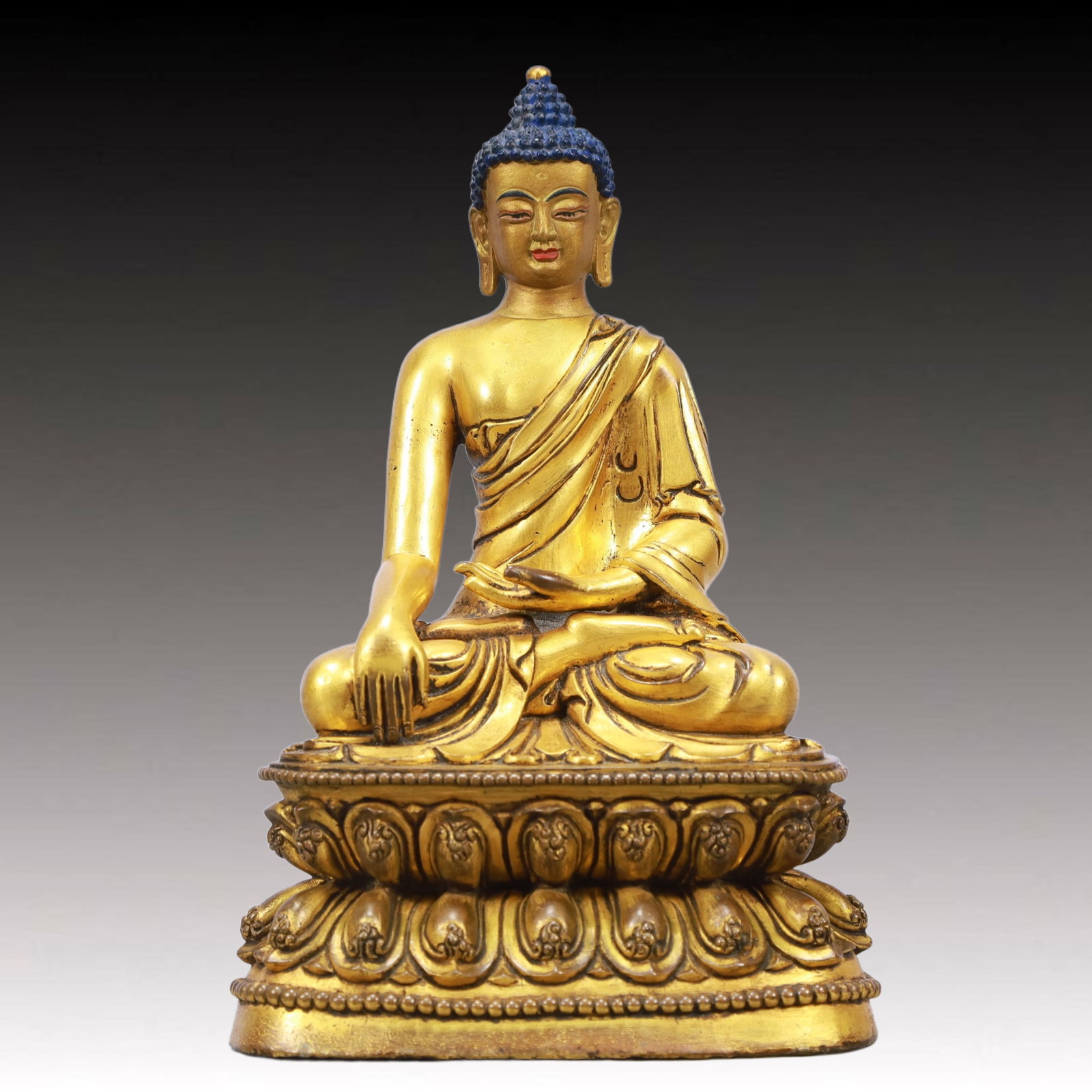 A Solemn Gilt Bronze Statue of Sakyamuni: A Solemn Gilt Bronze Statue of Sakyamuni,Ming Dynasty, China,Size:5.5inx3.9inx8.5in Weight:1750g 铜鎏金释迦摩尼像,中国明代