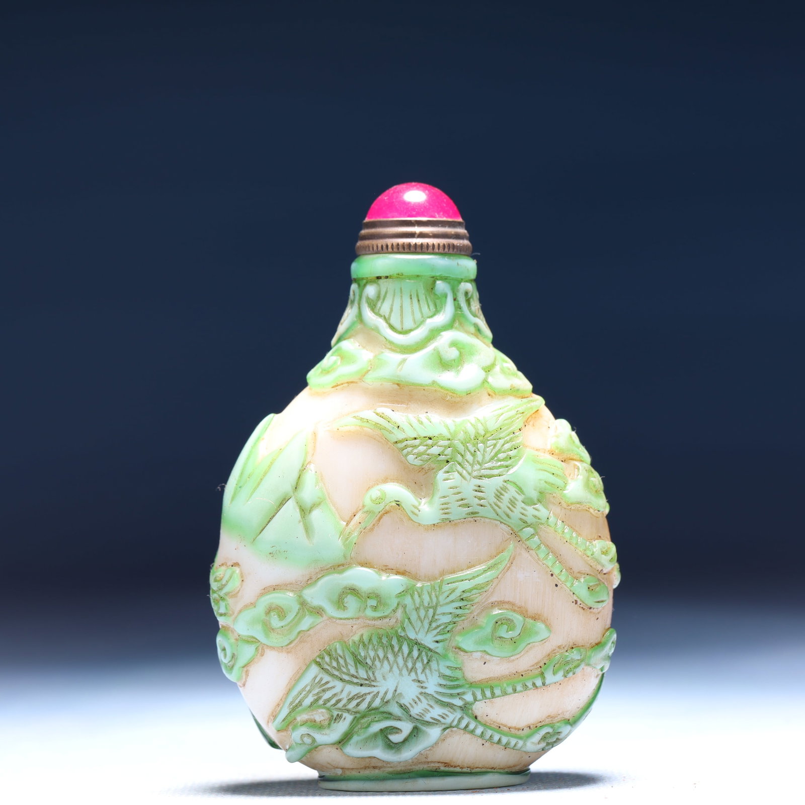 An Exquisite Glass Auspicious Cloud and Crane Pattern Snuff Bottle: An Exquisite Glass Auspicious Cloud and Crane Pattern Snuff Bottle,Qing Dynasty,China,Qianlong Four-character Mark,Size:2.2inx1.2inx3.1in,Weight:74g 琉璃祥云鹤纹