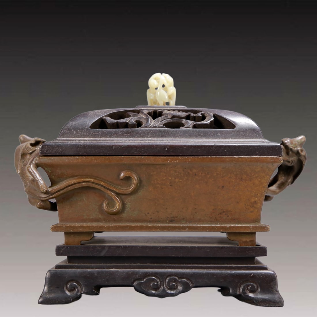An Archaic Bronze Dragon-Ears Censer,with Zitanwood Inlaid White Jade Cover: An Archaic Bronze Dragon-Ears Censer,with Zitanwood Inlaid White Jade Cover,Ming Dynasty, China,Jiajing Six-character Mark,Size:7.5inx4.1inx5.5in,Weight:1900g