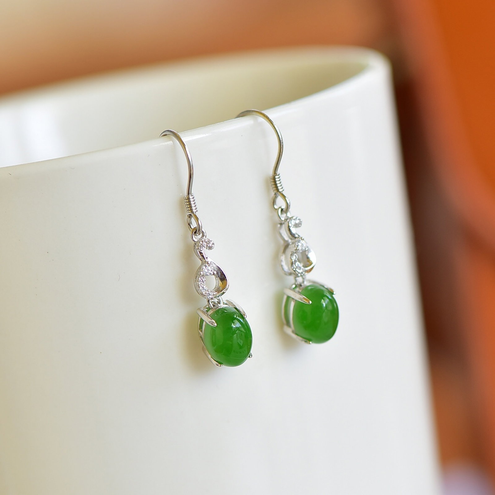 A Pair of Exquisite Sterling Silver Inlaid White Jade Earrings , Inlaid Diamonds: A Pair of Exquisite Sterling Silver Inlaid White Jade Earrings , Inlaid Diamond , Size :0.2inx0.3in 一对纯银镶白玉耳环,嵌钻石,&#