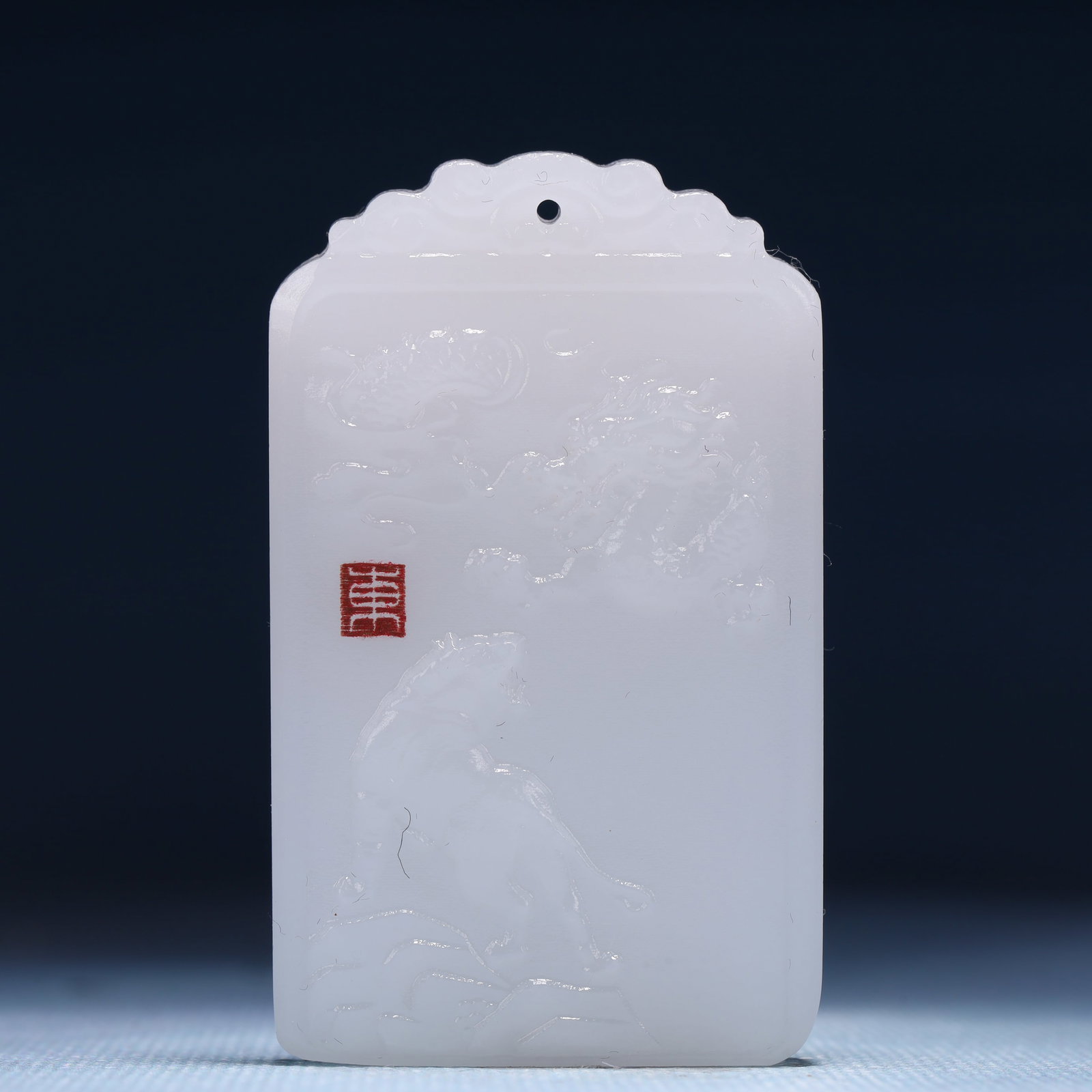 An Exquisite White Jade Animal Pattern Pendant: An Exquisite White Jade Animal Pattern Pendant,Size:1.6inx0.4inx2.4in,Weight:52g 白玉动物纹牌
