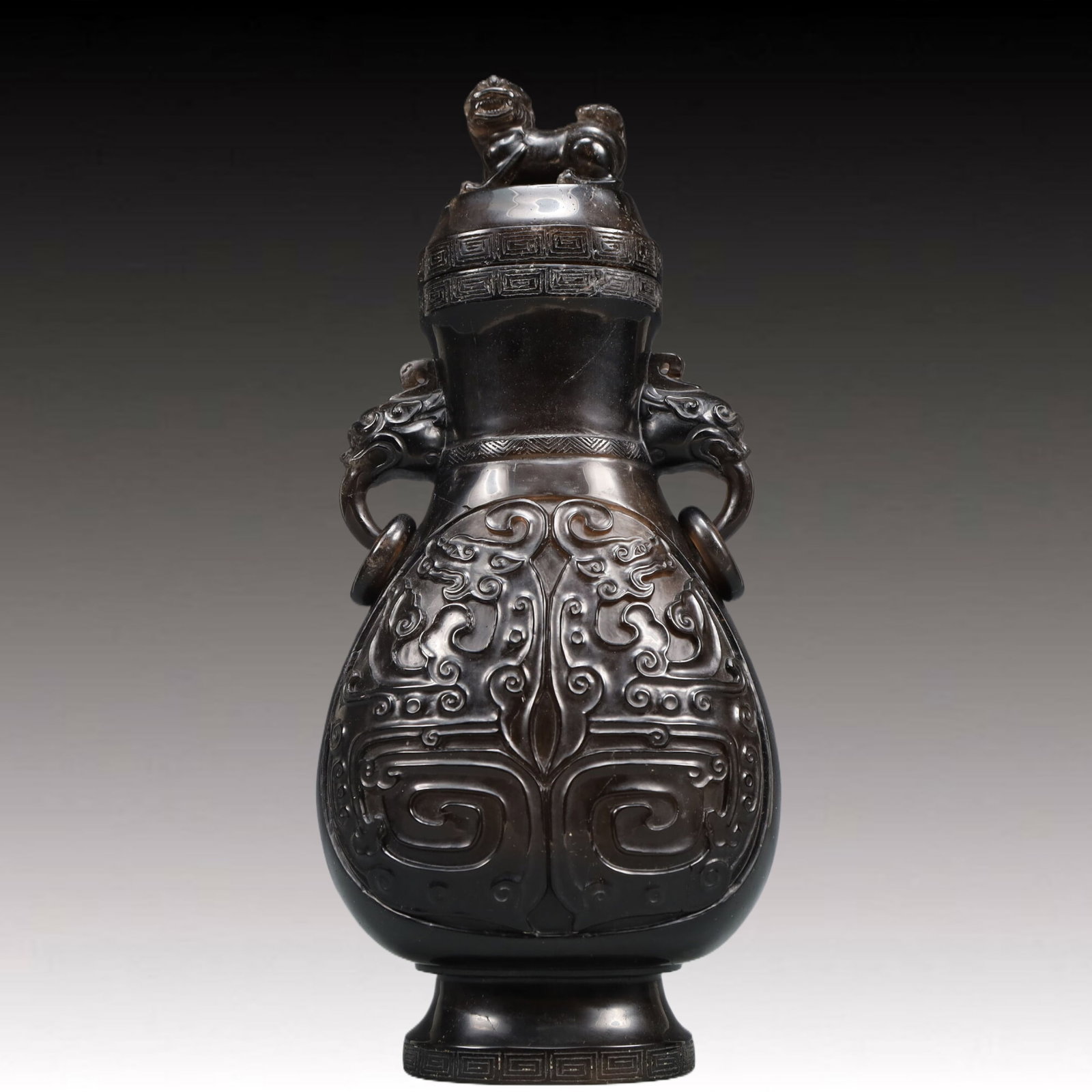 An Exquisite Crystal Beast-Face Pattern Double-Ears Vase: An Exquisite Crystal Beast-Face Pattern Double-Ears Vase,Qing Dynasty, China,Size:4.7inx3.1inx9.8in Weight:1150g 水晶兽面纹双耳瓶,中国଀