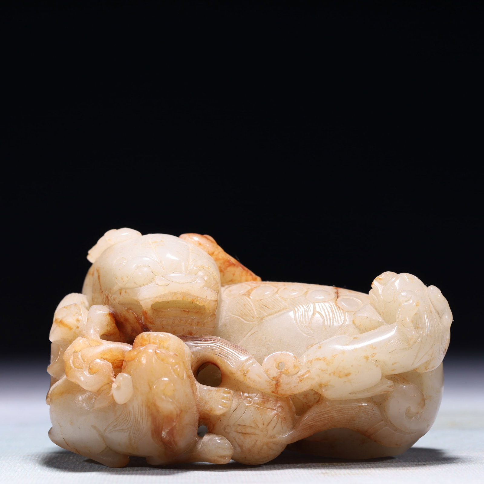 An Exquisite White Jade Lion Ornament (1 of 10)