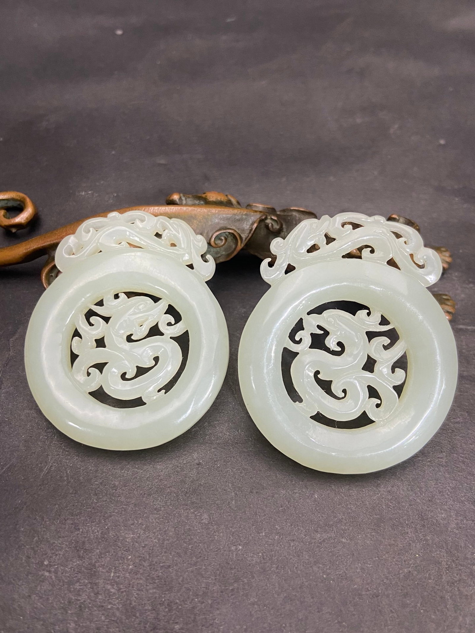 A Pair of Exquisite White Jade Hollow Dragon and Phoenix Pattern Pendants: A Pair of Exquisite White Jade Hollow Dragon and Phoenix Pattern Pendants,Qing Dynasty,China,Size:2.1inx1.8inx0.3in,Weight:27g 一对白玉镂空龙凤纹&