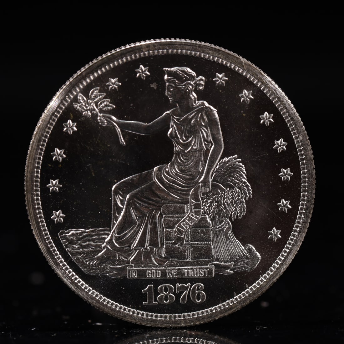 USA Trade Dollar 1876 Coin: American coin. Obverse: Liberty seated on a pedestal facing the sea to the left holding olive branches surrounded by 13 stars. IN GOD WE TRUST / LIBERTY / 1876. Reverse: An eagle holding branches with
