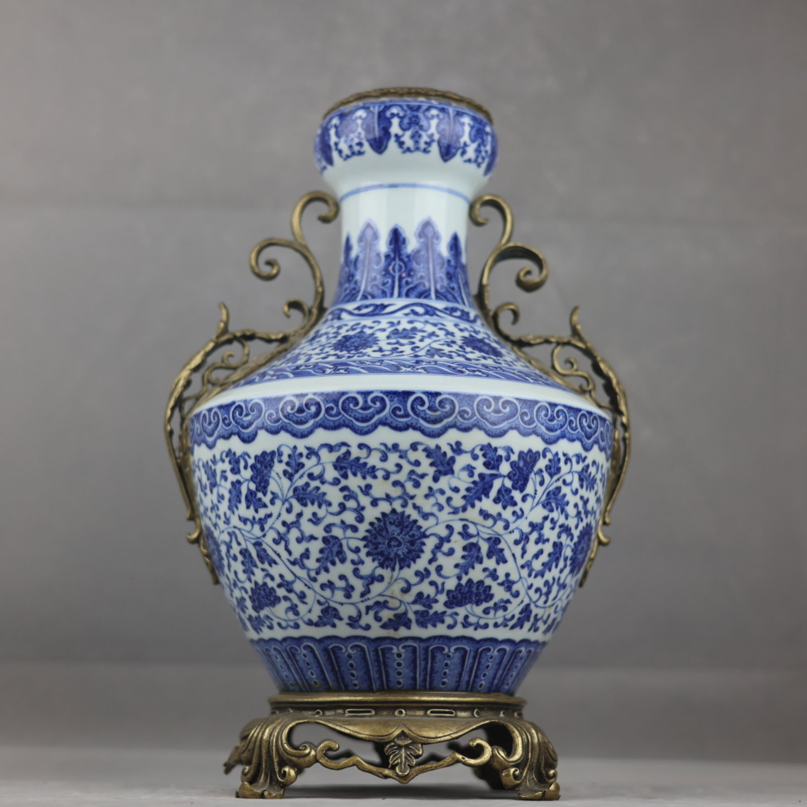 A Huge Blue and White Inlaid Gilt Bronze Lotus Pattern Double-Ears Vase: A Huge Blue and White Inlaid Gilt Bronze Lotus Pattern Double-Ears Vase,Qing Dynasty,China,Qianlong Six-character Mark,Size:16.3inx10.2in